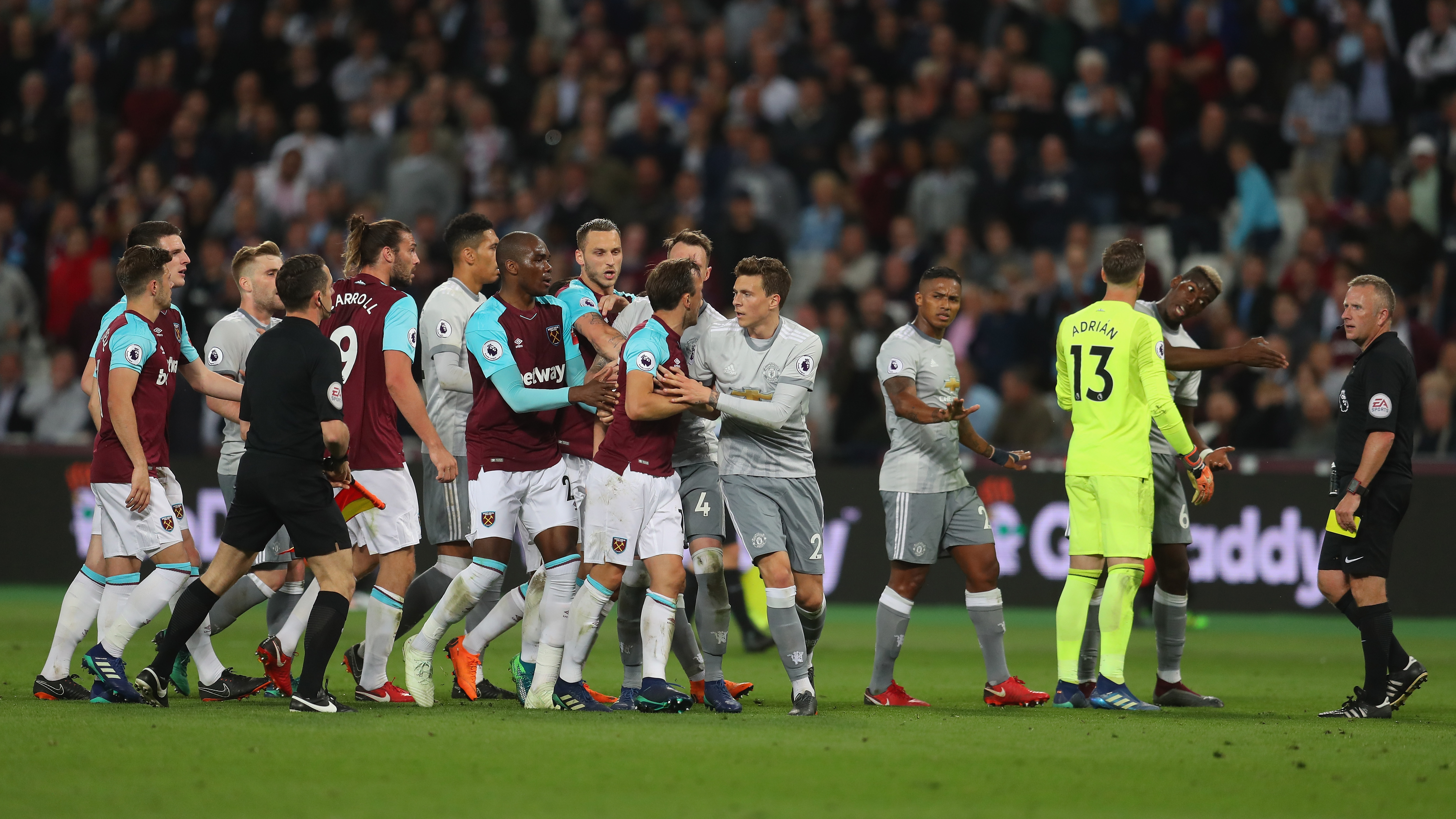 LONDON, ENGLAND - MAY 10:  Paul Pogba of Manchester United speaks to referee Jonathan Moss as Mark Noble of West Ham United gets upset during the Premier League match between West Ham United and Manchester United at London Stadium on May 10, 2018 in London, England.  (Photo by Catherine Ivill/Getty Images)