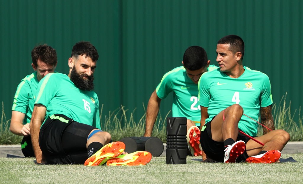 SOCHI, RUSSIA - JUNE 25: Mile Jedinak and Tim Cahill of Australia speak whilst stretching during a training session during an Australian Socceroos media opportunity at Park Arena on June 25, 2018 in Sochi, Russia. (Photo by Robert Cianflone/Getty Images)