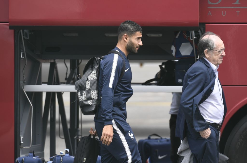 France's forward Nabil Fekir (C) and the President of the FFF Noel Le Graet (R) carry their luggages before taking a plane to Russia on June 10, 2018 at the Bron's airport near Lyon, central-eastern France, ahead of the Russia 2018 World Cup. (Photo by PHILIPPE DESMAZES / AFP) (Photo credit should read PHILIPPE DESMAZES/AFP/Getty Images)