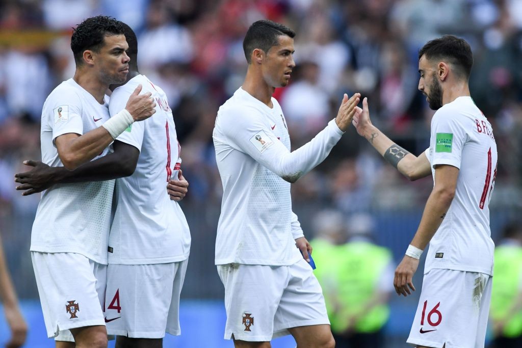 (From L) Portugal's defender Pepe, Portugal's midfielder William Carvalho, Portugal's forward Cristiano Ronaldo and Portugal's midfielder Bruno Fernandes celebrate after winning at the end of the Russia 2018 World Cup Group B football match between Portugal and Morocco at the Luzhniki Stadium in Moscow on June 20, 2018. (Photo by Kirill KUDRYAVTSEV / AFP) / RESTRICTED TO EDITORIAL USE - NO MOBILE PUSH ALERTS/DOWNLOADS (Photo credit should read KIRILL KUDRYAVTSEV/AFP/Getty Images)