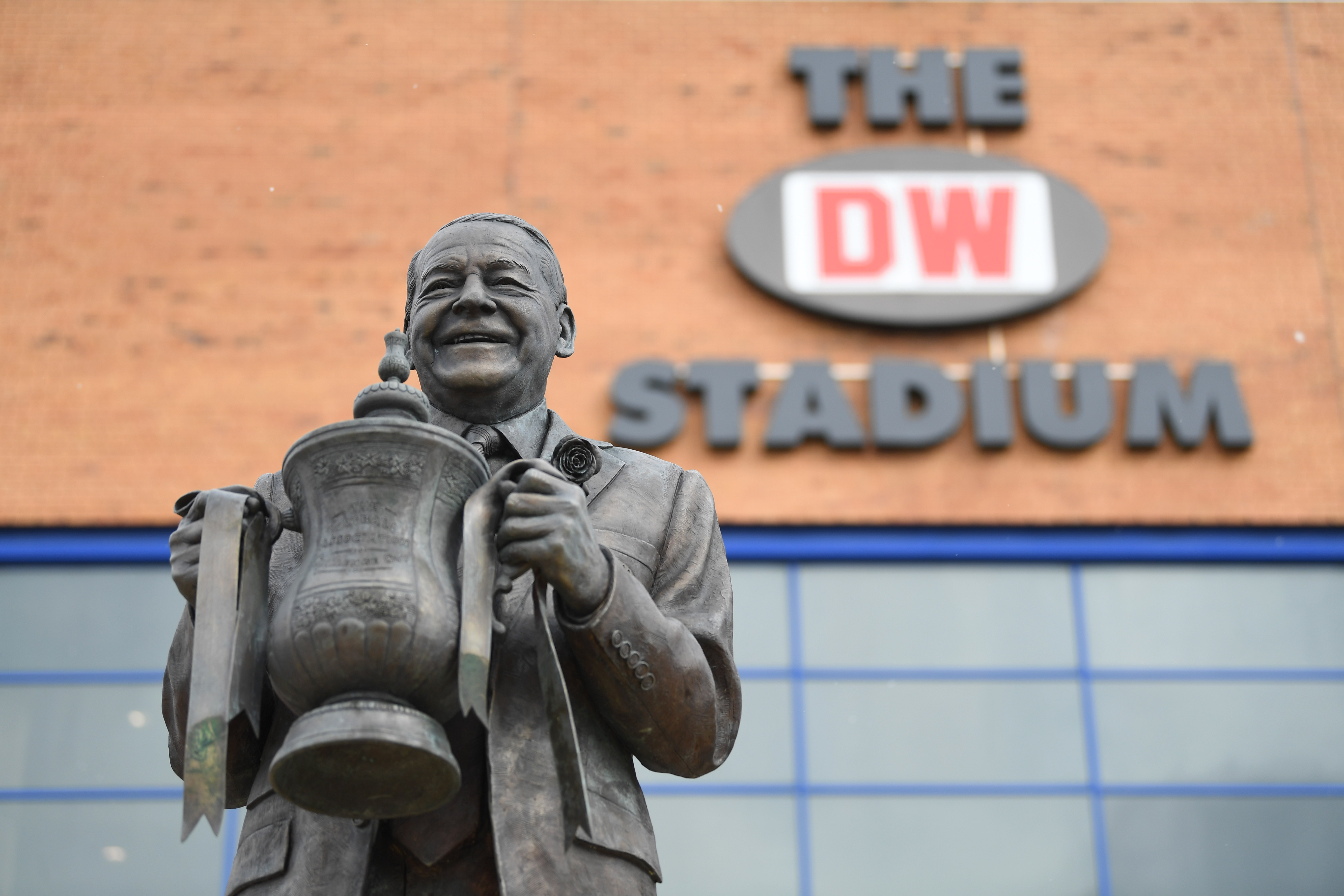 WIGAN, ENGLAND - MARCH 18:  A statue of Dave Whelan is seen outside the stadium prior to The Emirates FA Cup Quarter Final match between Wigan Athletic and Southampton at DW Stadium on March 18, 2018 in Wigan, England.  (Photo by Gareth Copley/Getty Images)