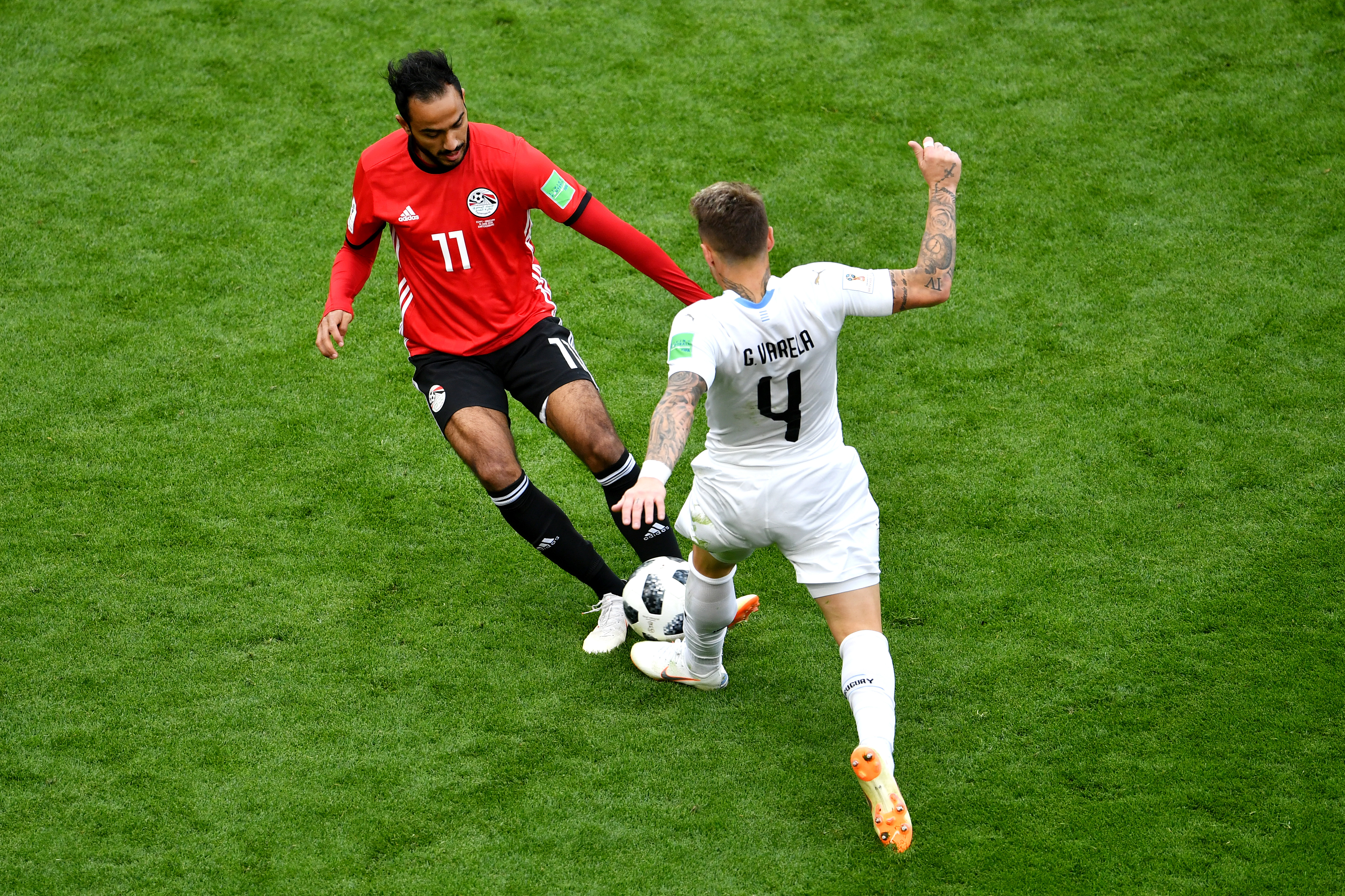 YEKATERINBURG, RUSSIA - JUNE 15:  Guillermo Varela of Uruguay battles for possession with Kahraba of Egypt during the 2018 FIFA World Cup Russia group A match between Egypt and Uruguay at Ekaterinburg Arena on June 15, 2018 in Yekaterinburg, Russia.  (Photo by Dan Mullan/Getty Images)