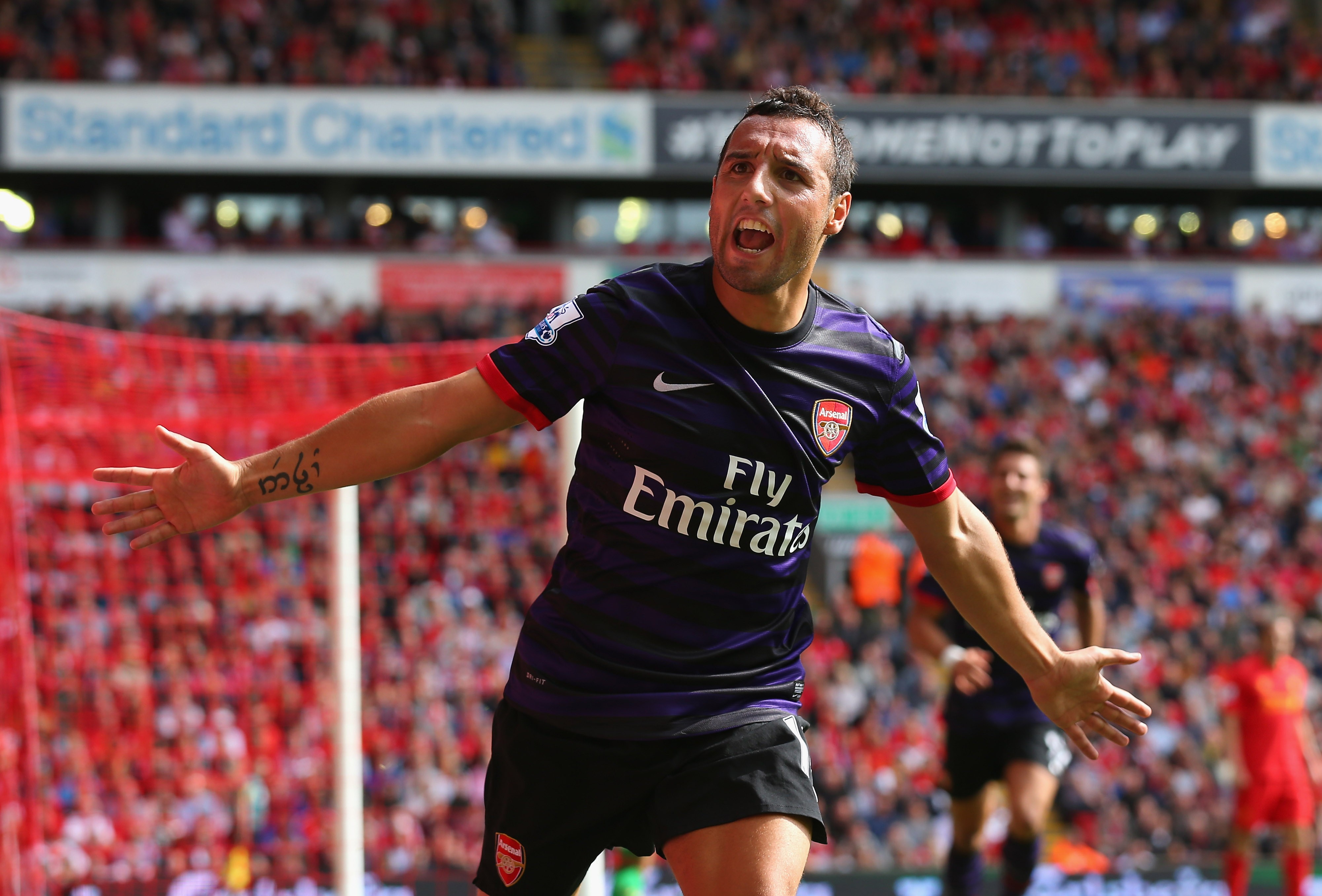 LIVERPOOL, ENGLAND - SEPTEMBER 02: Santi Cazorla of Arsenal celebrates after scoring the second goal during the Barclays Premier League match between Liverpool and Arsenal at Anfield on September 2, 2012 in Liverpool, England. (Photo by Alex Livesey/Getty Images)