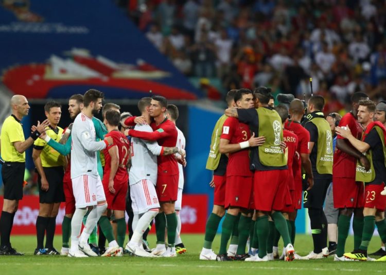 SOCHI, RUSSIA - JUNE 15: Spain and Portugal players hugh each other following the 2018 FIFA World Cup Russia group B match between Portugal and Spain at Fisht Stadium on June 15, 2018 in Sochi, Russia. (Photo by Dean Mouhtaropoulos/Getty Images)