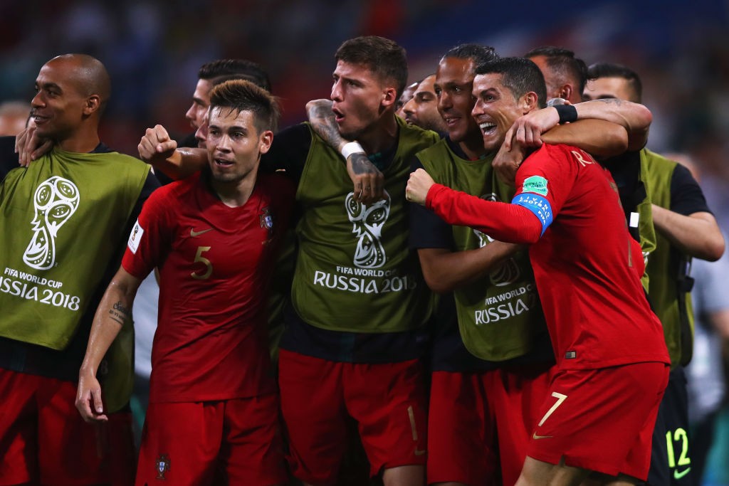 SOCHI, RUSSIA - JUNE 15: Cristiano Ronaldo of Portugal celebrates with team mates after scoring his team's second goal of the match during the 2018 FIFA World Cup Russia group B match between Portugal and Spain at Fisht Stadium on June 15, 2018 in Sochi, Russia. (Photo by Dean Mouhtaropoulos/Getty Images)