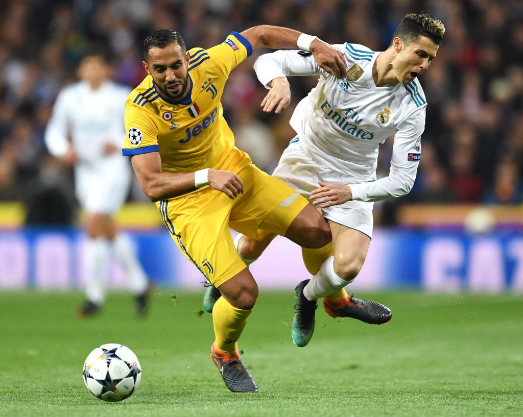 MADRID, SPAIN - APRIL 11: Cristiano Ronaldo of Real Madrid is fouled by Medhi Benatia of Juventus during the UEFA Champions League Quarter Final Second Leg match between Real Madrid and Juventus at Estadio Santiago Bernabeu on April 11, 2018 in Madrid, Spain. (Photo by David Ramos/Getty Images)