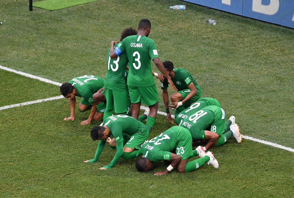 VOLGOGRAD, RUSSIA - JUNE 25: Salman Alfaraj of Saudi Arabia celebrates with teammates after scoring his team's first goal during the 2018 FIFA World Cup Russia group A match between Saudia Arabia and Egypt at Volgograd Arena on June 25, 2018 in Volgograd, Russia. (Photo by Laurence Griffiths/Getty Images)