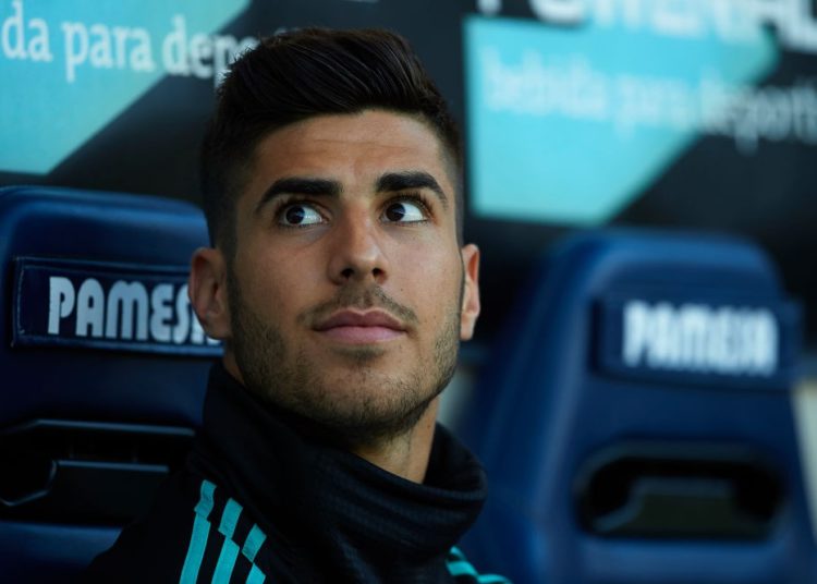 VILLARREAL, SPAIN - MAY 19: Marco Asensio of Real Madrid sits on the substitutes bench during the La Liga match between Villarreal and Real Madrid at Estadio de La Ceramica on May 19, 2018 in Villarreal, Spain. (Photo by Manuel Queimadelos Alonso/Getty Images)