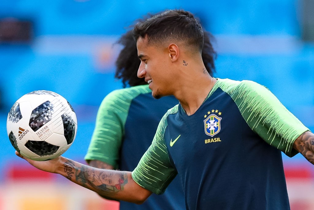 MOSCOW, RUSSIA - JUNE 26: Phillipe Coutinho (F) jokes with a Marcelo during a Brazil training session and press conference ahead of the Group E match against Serbia at Spartak Stadium on June 26, 2018 in Moscow, Russia. (Photo by Buda Mendes/Getty Images)