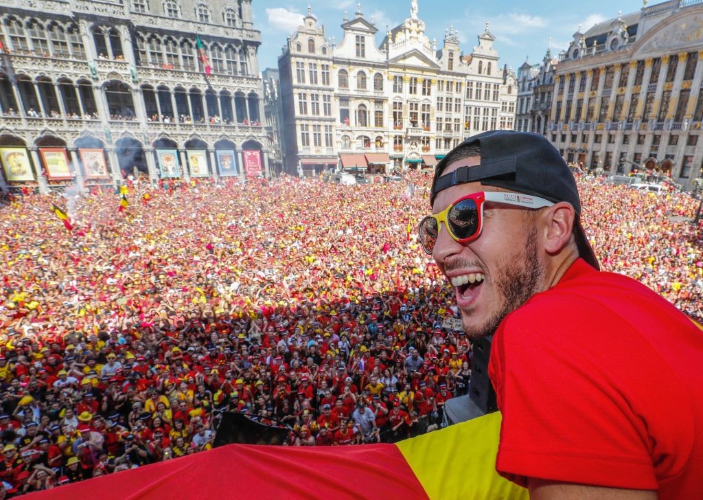 Belgium's captain Eden Hazard celebrates at the Grand Place/Grote Markt in Brussels city center, as Belgian national football team Red Devils arrive to celebrate with supporters at the balcony of the city hall after reaching the semi-finals and winning the bronze medal at the Russia 2018 World Cup on July 15, 2018. (Photo by Yves HERMAN / BELGA / AFP) / Belgium OUT (Photo credit should read YVES HERMAN/AFP/Getty Images)