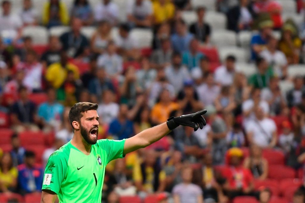 Brazil's goalkeeper Alisson speaks to his teammates during the Russia 2018 World Cup quarter-final football match between Brazil and Belgium at the Kazan Arena in Kazan on July 6, 2018. (Photo by MANAN VATSYAYANA / AFP) / RESTRICTED TO EDITORIAL USE - NO MOBILE PUSH ALERTS/DOWNLOADS (Photo credit should read MANAN VATSYAYANA/AFP/Getty Images)