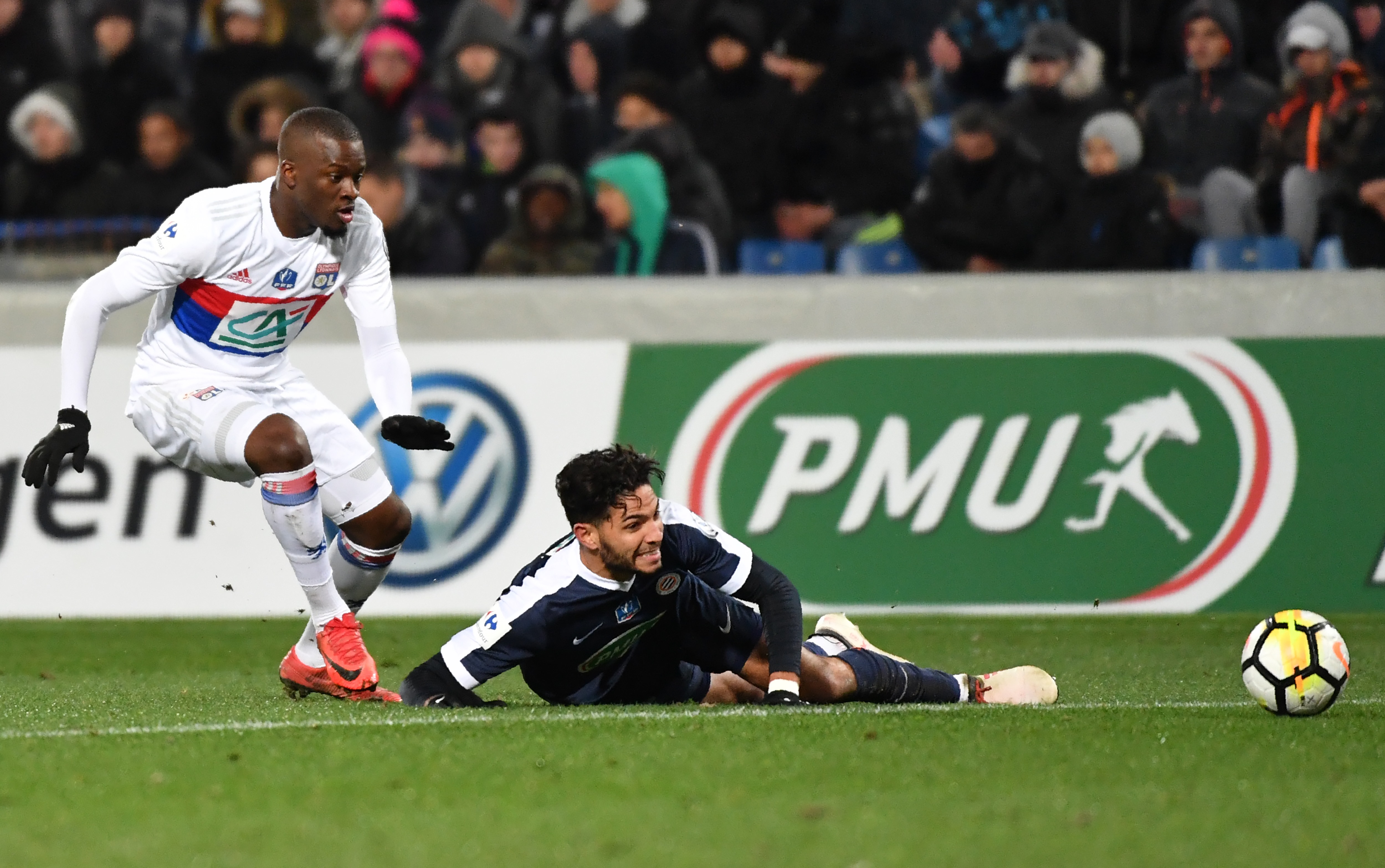 Lyon's French midfielder Tanguy Ndombele (L) vies with Montpellier's Portuguese defender Pedro Mendes (R) during the French Cup round of 8 football match Montpellier vs Lyon on February 7, 2018 at the La Mosson stadium in Montpellier, Southern France. / AFP PHOTO / PASCAL GUYOT        (Photo credit should read PASCAL GUYOT/AFP/Getty Images)