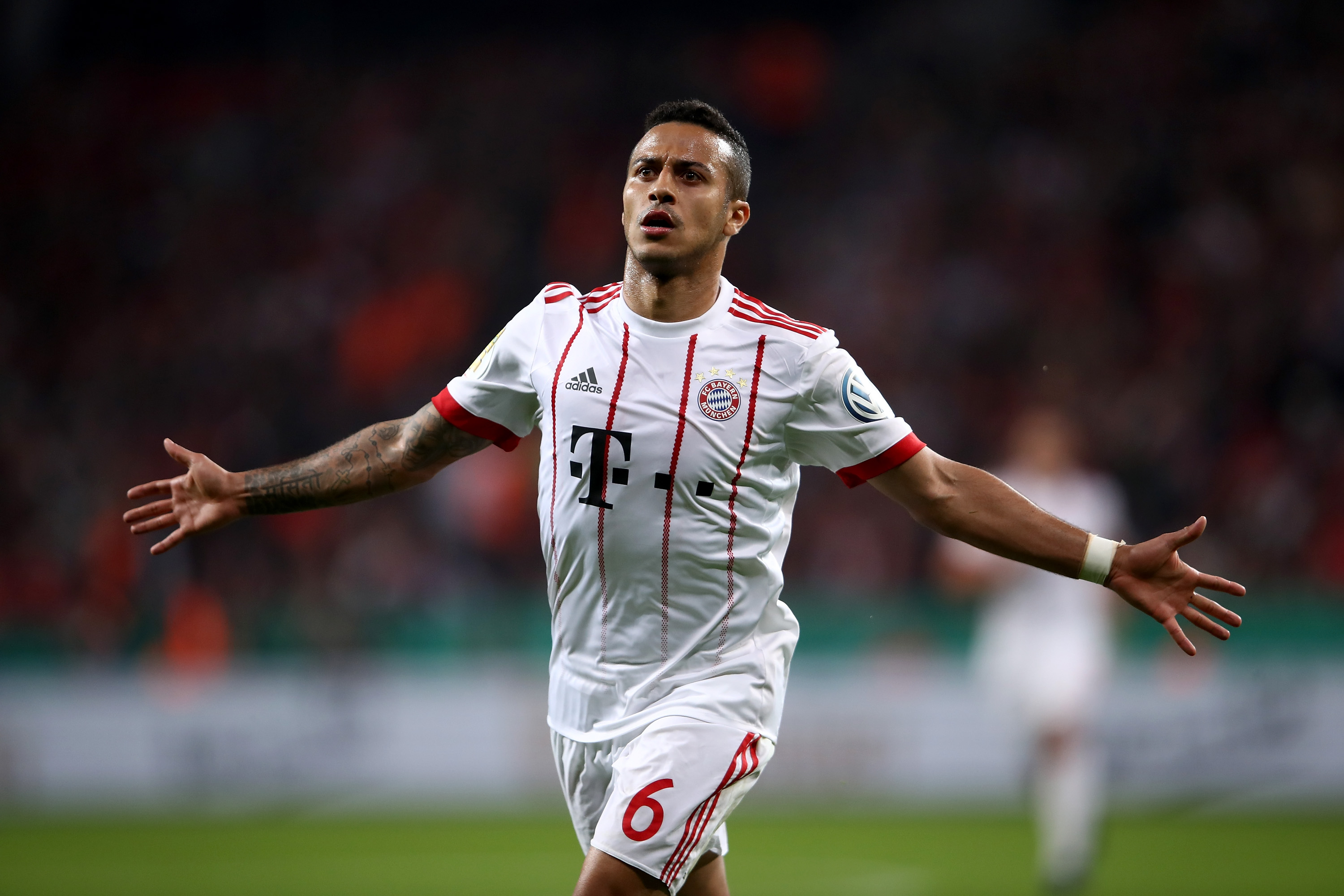 LEVERKUSEN, GERMANY - APRIL 17:  Thiago of Bayern celebrates after he scores the 4th goal during the DFB Cup semi final match between Bayer 04 Leverkusen and Bayern Munchen at BayArena on April 17, 2018 in Leverkusen, Germany.  (Photo by Alex Grimm/Bongarts/Getty Images)
