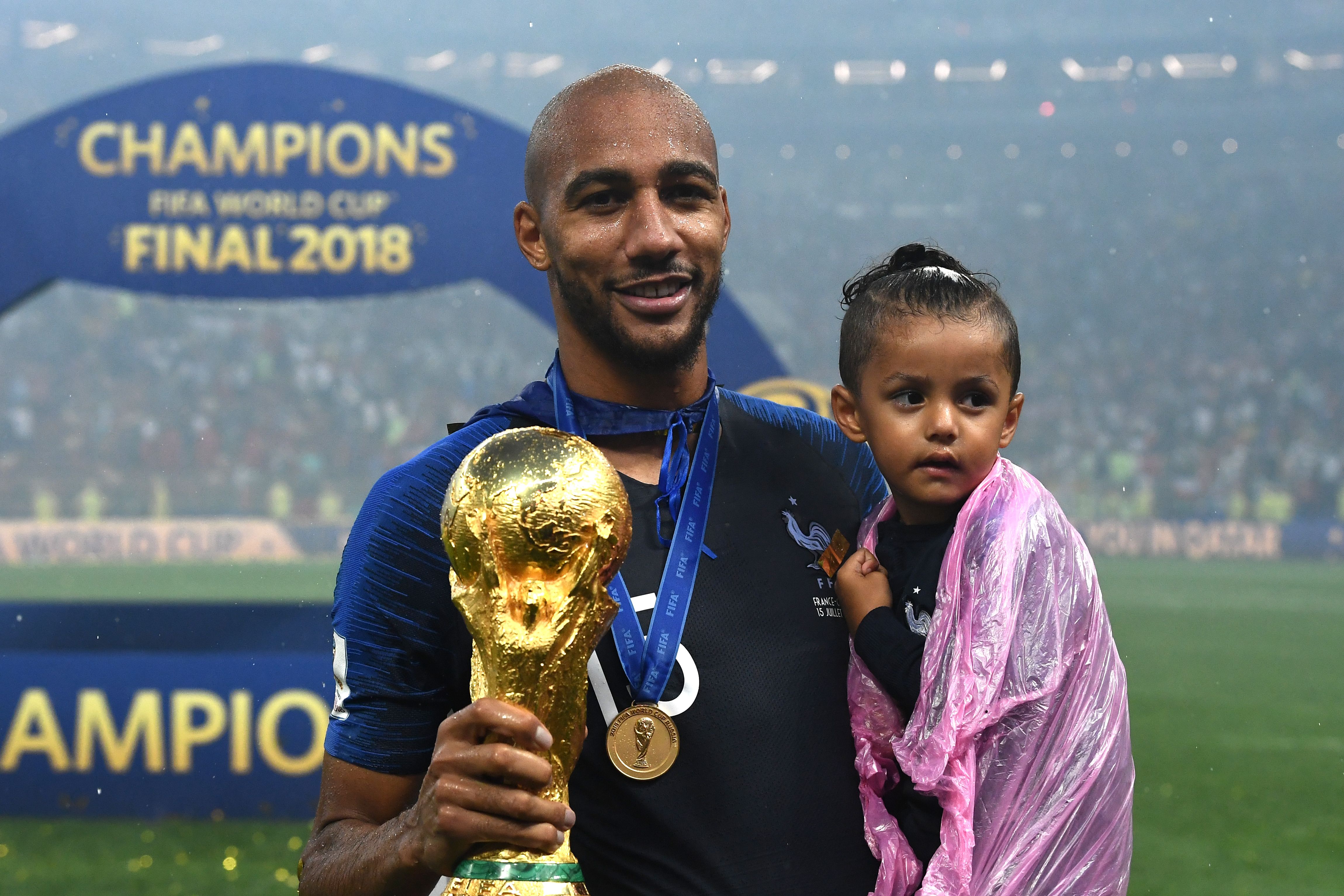 France's midfielder Steven N'Zonzi holds the World Cuop trophy as he poses with his daughter after winning the Russia 2018 World Cup final football match between France and Croatia at the Luzhniki Stadium in Moscow on July 15, 2018. (Photo by FRANCK FIFE / AFP) / RESTRICTED TO EDITORIAL USE - NO MOBILE PUSH ALERTS/DOWNLOADS        (Photo credit should read FRANCK FIFE/AFP/Getty Images)