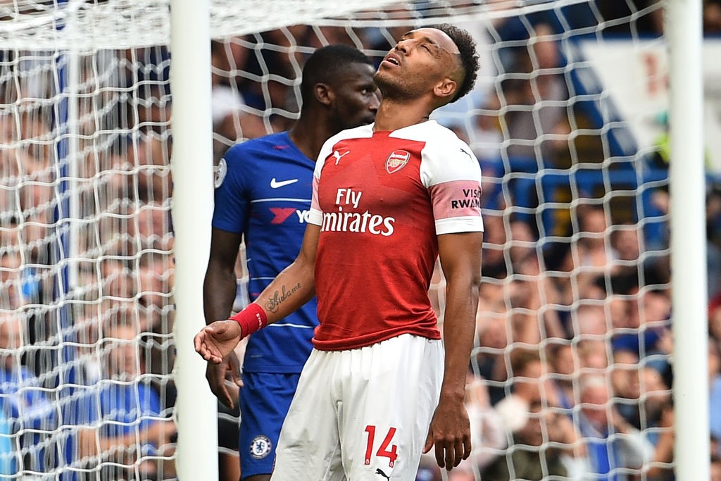 Arsenal's Gabonese striker Pierre-Emerick Aubameyang reacts after missing a chance during the English Premier League football match between Chelsea and Arsenal at Stamford Bridge in London on August 18, 2018. (Photo by Glyn KIRK / AFP) / RESTRICTED TO EDITORIAL USE. No use with unauthorized audio, video, data, fixture lists, club/league logos or 'live' services. Online in-match use limited to 120 images. An additional 40 images may be used in extra time. No video emulation. Social media in-match use limited to 120 images. An additional 40 images may be used in extra time. No use in betting publications, games or single club/league/player publications. / (Photo credit should read GLYN KIRK/AFP/Getty Images)