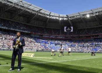 yon's French midfielder Nabil Fekir presents the World cup trophy to fans before the French L1 football match between Lyon and Amiens on August 12 , 2018, in Decines-Charpieu near Lyon, central-eastern France. (Photo by PHILIPPE DESMAZES / AFP) (Photo credit should read PHILIPPE DESMAZES/AFP/Getty Images)