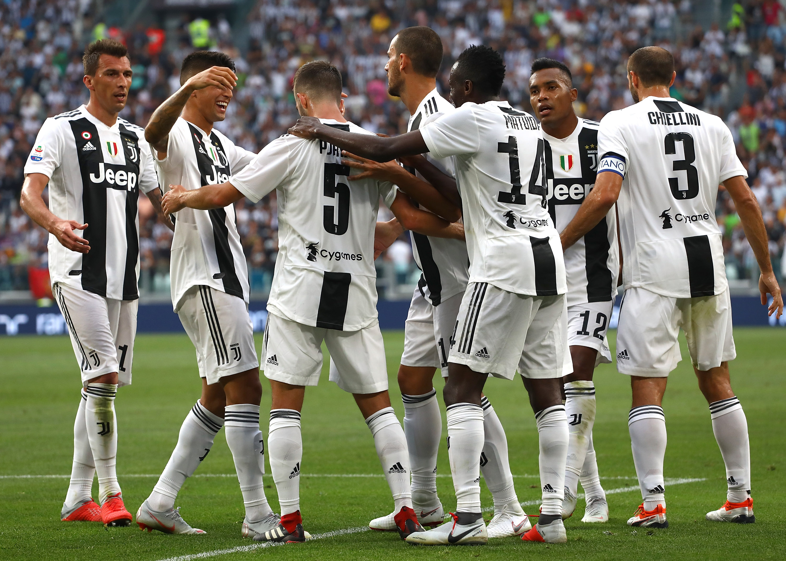 TURIN, ITALY - AUGUST 25:  Miralem Pjanic #5 of Juventus celebrates with his team-mates after scoring the opening goal during the Serie A match between Juventus and SS Lazio at Allianz Stadium on August 25, 2018 in Turin, Italy.  (Photo by Marco Luzzani/Getty Images)