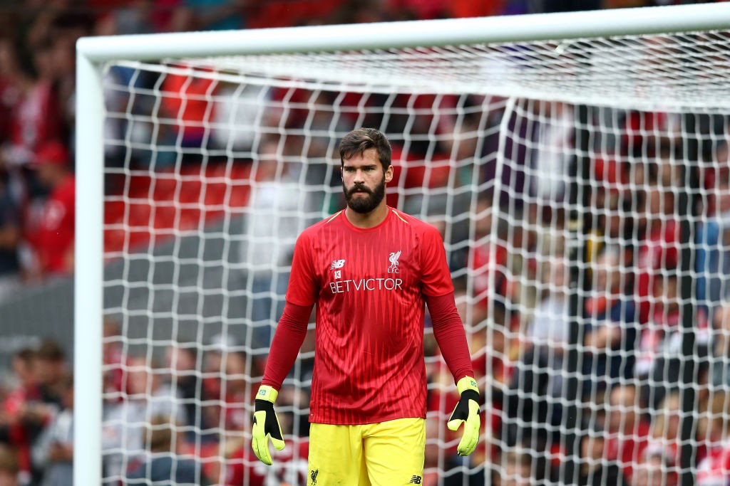 LIVERPOOL, ENGLAND - AUGUST 07: Alisson Becker of Liverpool warms up during the pre-season friendly match between Liverpool and Torino at Anfield on August 7, 2018 in Liverpool, England. (Photo by Jan Kruger/Getty Images)