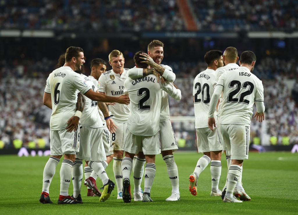 MADRID, SPAIN - AUGUST 19: Dani Carvajal of Real Madrid celebrates with Sergio Ramos after scoring his teams opening goal during the La Liga match between Real Madrid CF and Getafe CF at Estadio Santiago Bernabeu on August 19, 2018 in Madrid, Spain. (Photo by Denis Doyle/Getty Images)