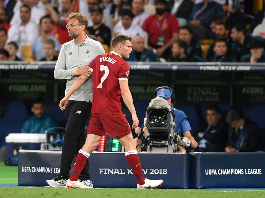 KIEV, UKRAINE - MAY 26: James Milner of Liverpool embraces Jurgen Klopp during the UEFA Champions League Final between Real Madrid and Liverpool at NSC Olimpiyskiy Stadium on May 26, 2018 in Kiev, Ukraine. (Photo by Laurence Griffiths/Getty Images)