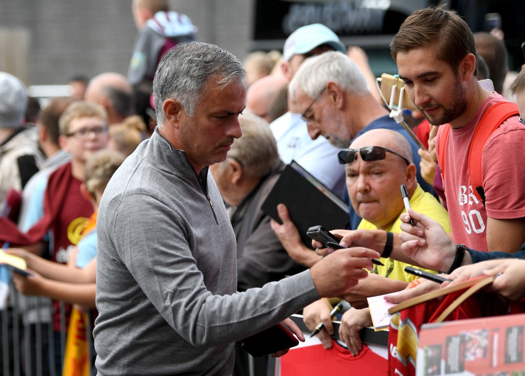 BURNLEY, ENGLAND - SEPTEMBER 02: Jose Mourinho, Manager of Manchester United signs autographs as he arrives prior to the Premier League match between Burnley FC and Manchester United at Turf Moor on September 2, 2018 in Burnley, United Kingdom. (Photo by Shaun Botterill/Getty Images)