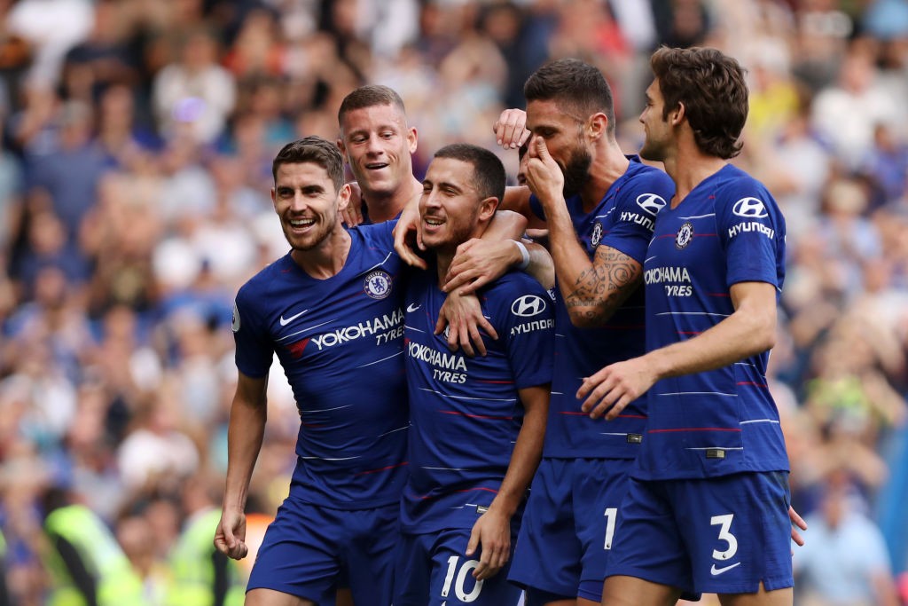 LONDON, ENGLAND - SEPTEMBER 15: Eden Hazard of Chelsea celebrates with teammates after scoring his team's third goal, from a penalty during the Premier League match between Chelsea FC and Cardiff City at Stamford Bridge on September 15, 2018 in London, United Kingdom. (Photo by Dan Istitene/Getty Images)
