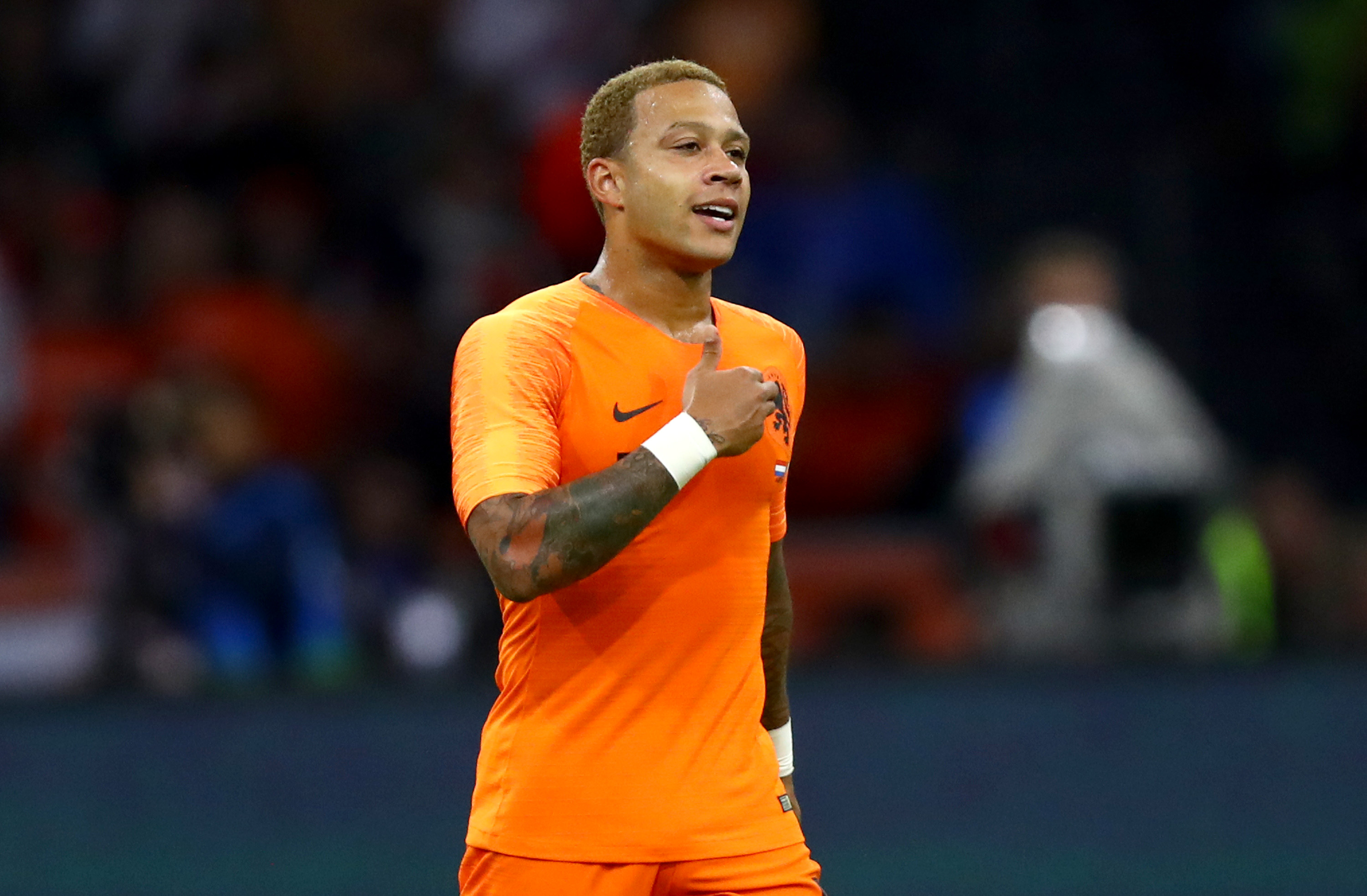 AMSTERDAM, NETHERLANDS - SEPTEMBER 06:  Memphis Depay of the Netherlands celebrates after scoring his team's first goal during the International Friendly match between Netherlands and Peru at Johan Cruyff Arena on September 6, 2018 in Amsterdam, Netherlands.  (Photo by Dean Mouhtaropoulos/Getty Images)