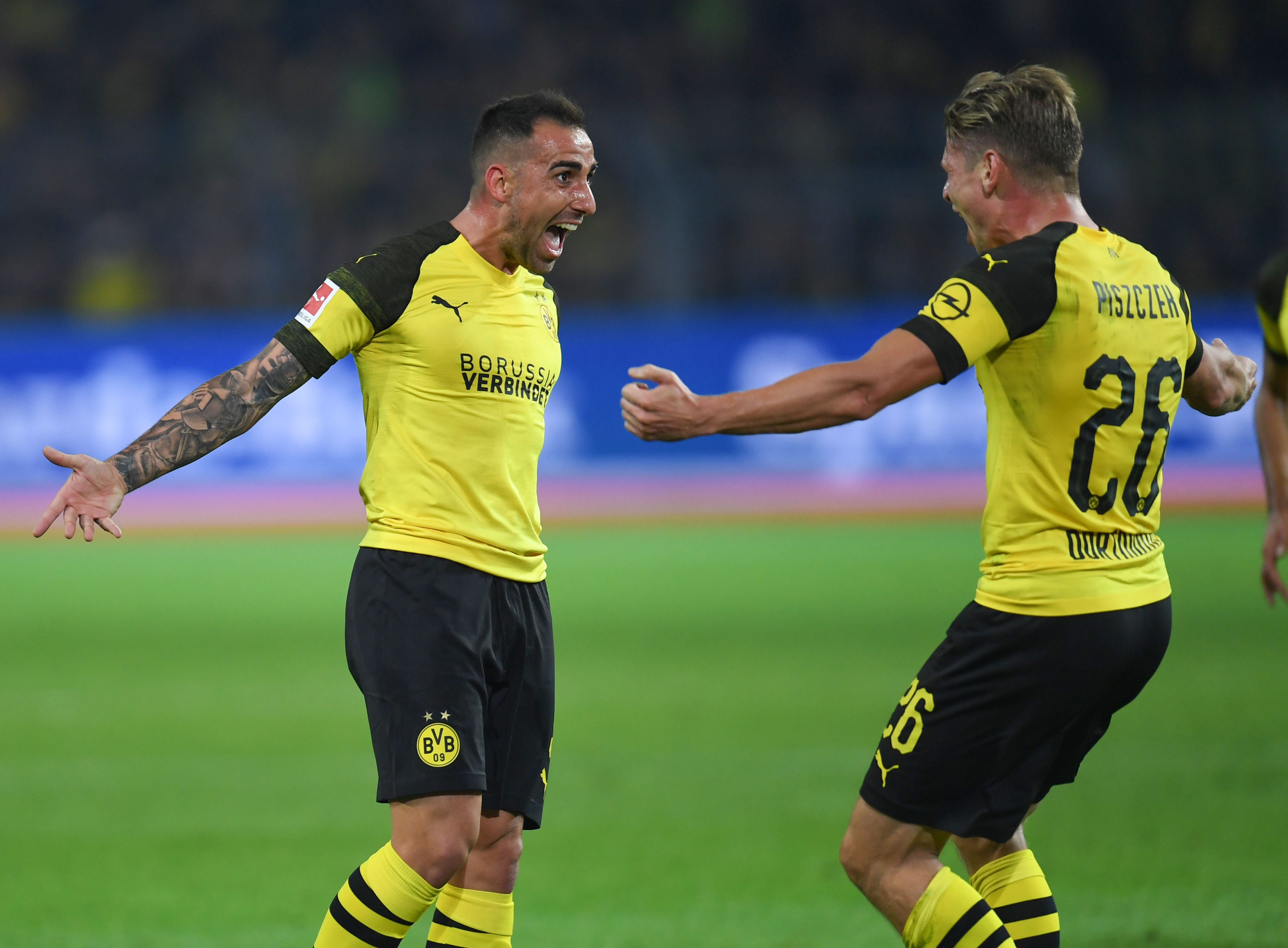 Dortmund's midfielder Paco Alacer celebrates with his teammates after scoring during the German first division Bundesliga football match Borussia Dortmund v Eintracht Frankfurt in Dortmund, western Germany, on September 14, 2018. (Photo by Patrik STOLLARZ / AFP) / RESTRICTIONS: DFL REGULATIONS PROHIBIT ANY USE OF PHOTOGRAPHS AS IMAGE SEQUENCES AND/OR QUASI-VIDEO        (Photo credit should read PATRIK STOLLARZ/AFP/Getty Images)