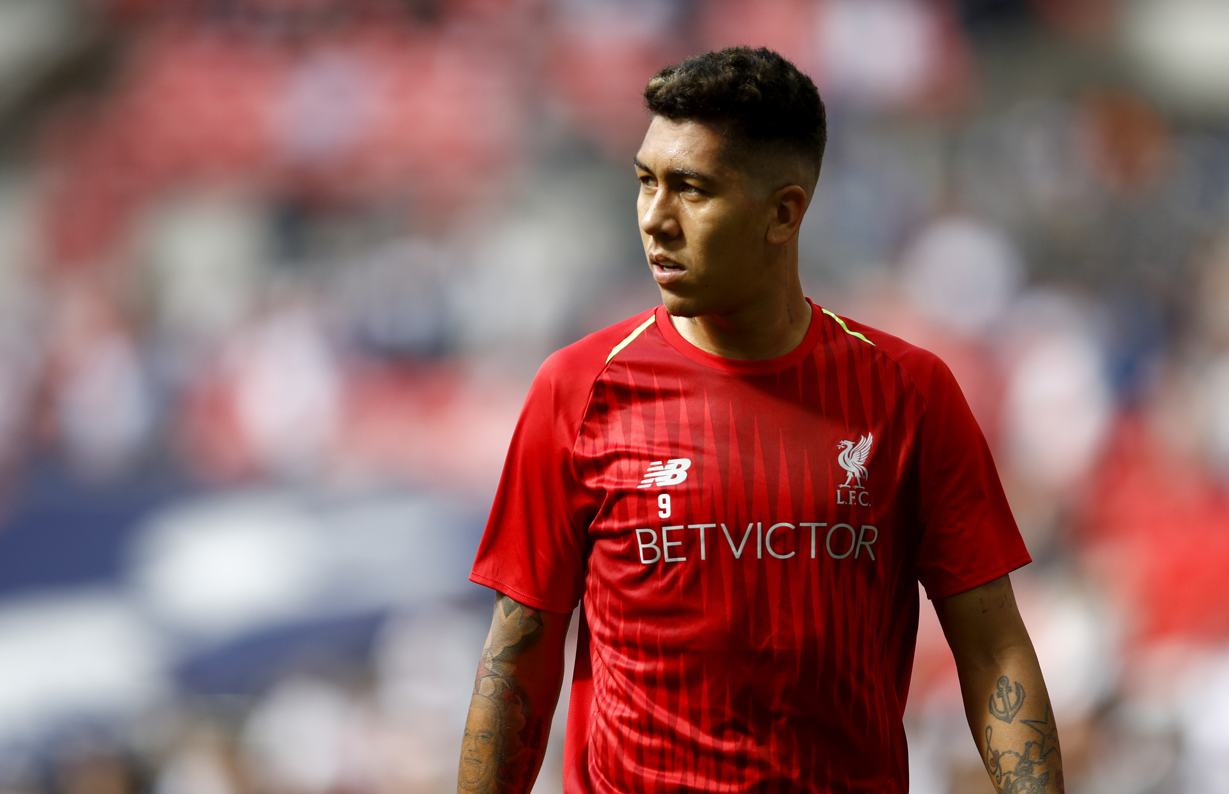 LONDON, ENGLAND - SEPTEMBER 15:  Roberto Firmino of Liverpool warms up ahead of the Premier League match between Tottenham Hotspur and Liverpool FC at Wembley Stadium on September 15, 2018 in London, United Kingdom.  (Photo by Julian Finney/Getty Images)