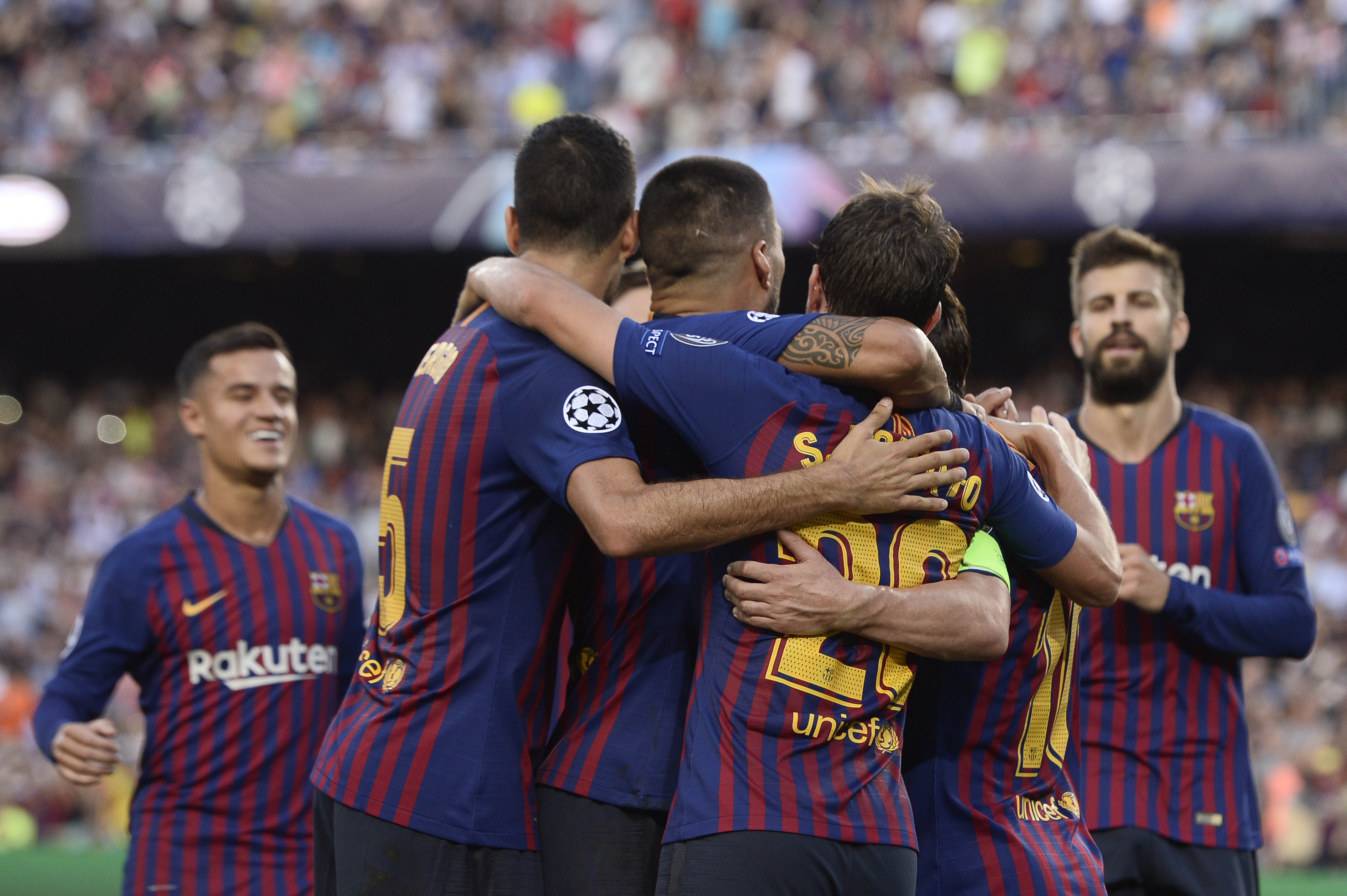 Barcelona's players celebrate after Argentinian forward Lionel Messi scored during the UEFA Champions' League group B football match FC Barcelona against PSV Eindhoven at the Camp Nou stadium in Barcelona on September 18, 2018. (Photo by Josep LAGO / AFP)        (Photo credit should read JOSEP LAGO/AFP/Getty Images)