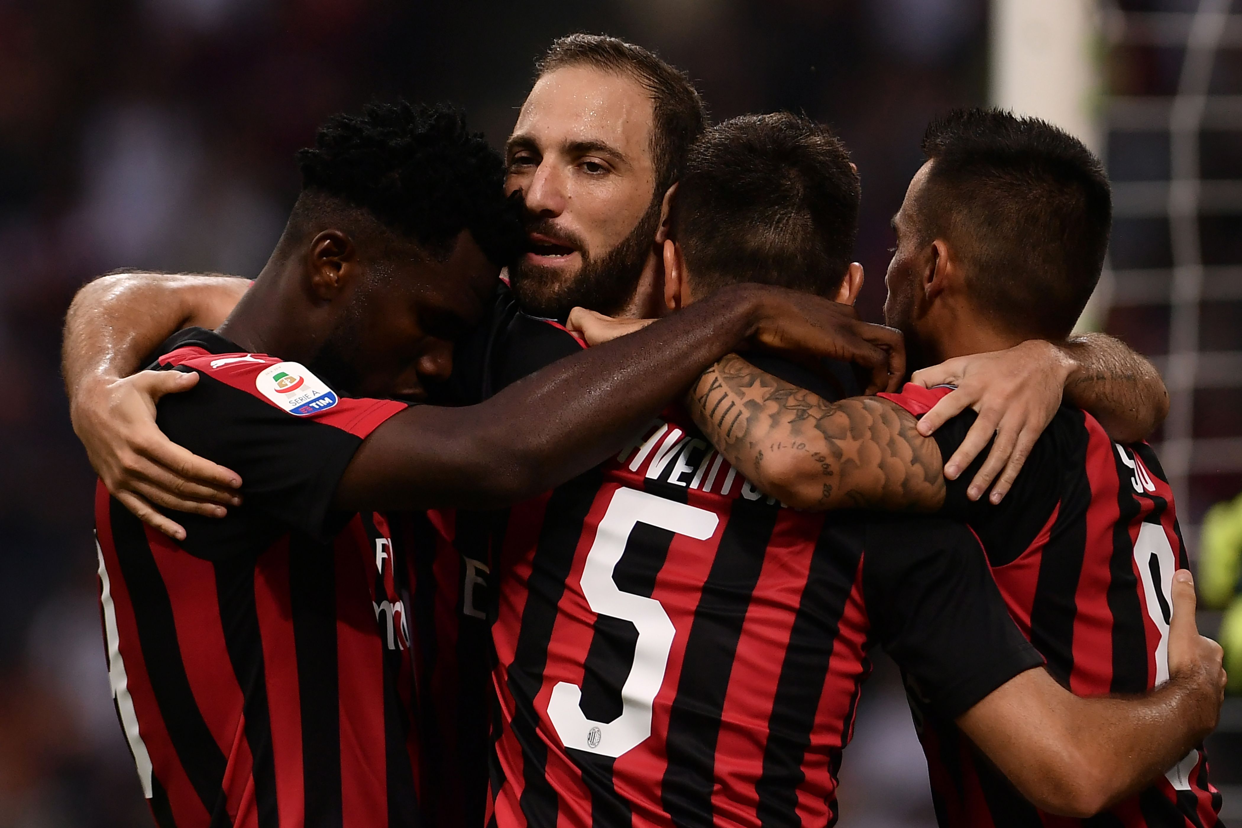 AC Milan's Italian midfielder Giacomo Bonaventura (5) celebrates with teammates after scoring during the Italian Serie A football match AC Milan vs Atalanta on September 23, 2018 at the "San Siro Stadium" in Milan. (Photo by MARCO BERTORELLO / AFP)        (Photo credit should read MARCO BERTORELLO/AFP/Getty Images)