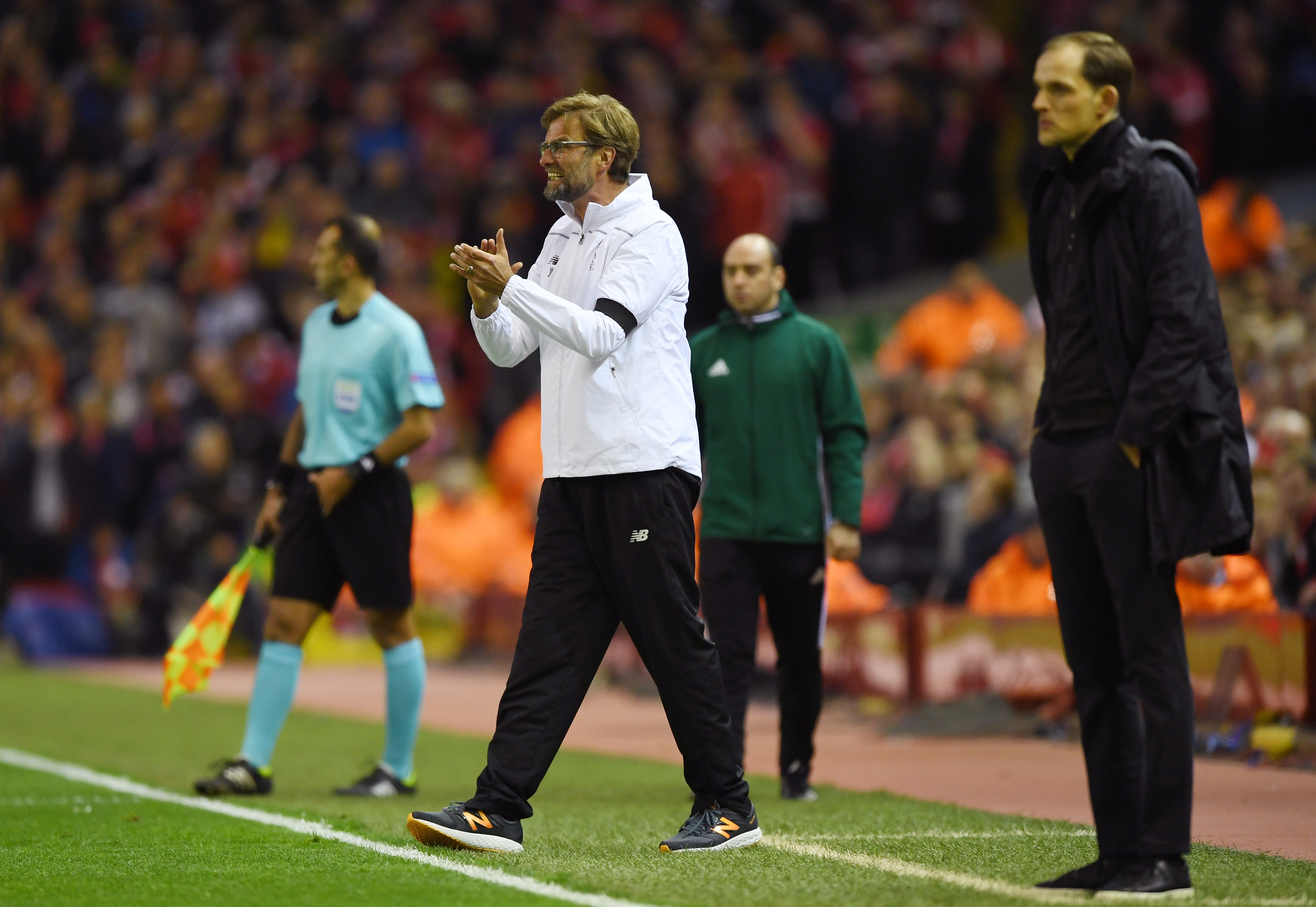 LIVERPOOL, ENGLAND - APRIL 14: Jurgen Klopp, manager of Liverpool encourages his team with Thomas Tuchel, coach of Borussia Dortmund during the UEFA Europa League quarter final, second leg match between Liverpool and Borussia Dortmund at Anfield on April 14, 2016 in Liverpool, United Kingdom.  (Photo by Shaun Botterill/Getty Images)