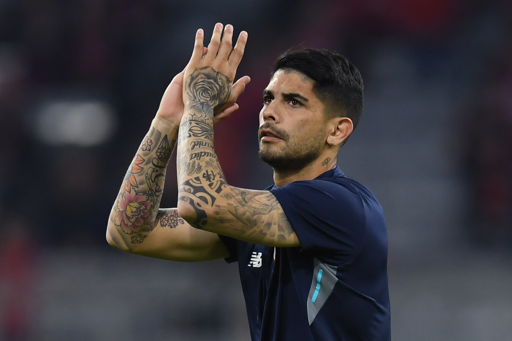 Sevilla's Argentinian midfielder Ever Banega applauds prior to the UEFA Champions League quarter-final second leg football match between FC Bayern Munich and Sevilla FC on April 11, 2018 in Munich, southern Germany. / AFP PHOTO / Christof STACHE        (Photo credit should read CHRISTOF STACHE/AFP/Getty Images)