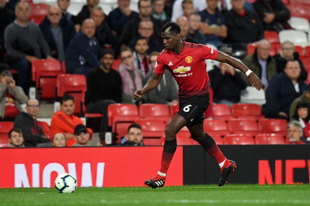 MANCHESTER, ENGLAND - AUGUST 27: Paul Pogba of Manchester United plays in front of empty seats towards the end of the match during the Premier League match between Manchester United and Tottenham Hotspur at Old Trafford on August 27, 2018 in Manchester, United Kingdom. (Photo by Michael Regan/Getty Images)