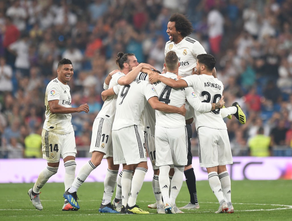 MADRID, SPAIN - SEPTEMBER 01: Karim Benzema (#9) of Real Madrid celebrates with teammates after scoring his teams second goal during the La Liga match between Real Madrid CF and CD Leganes at Estadio Santiago Bernabeu on September 1, 2018 in Madrid, Spain. (Photo by Denis Doyle/Getty Images)