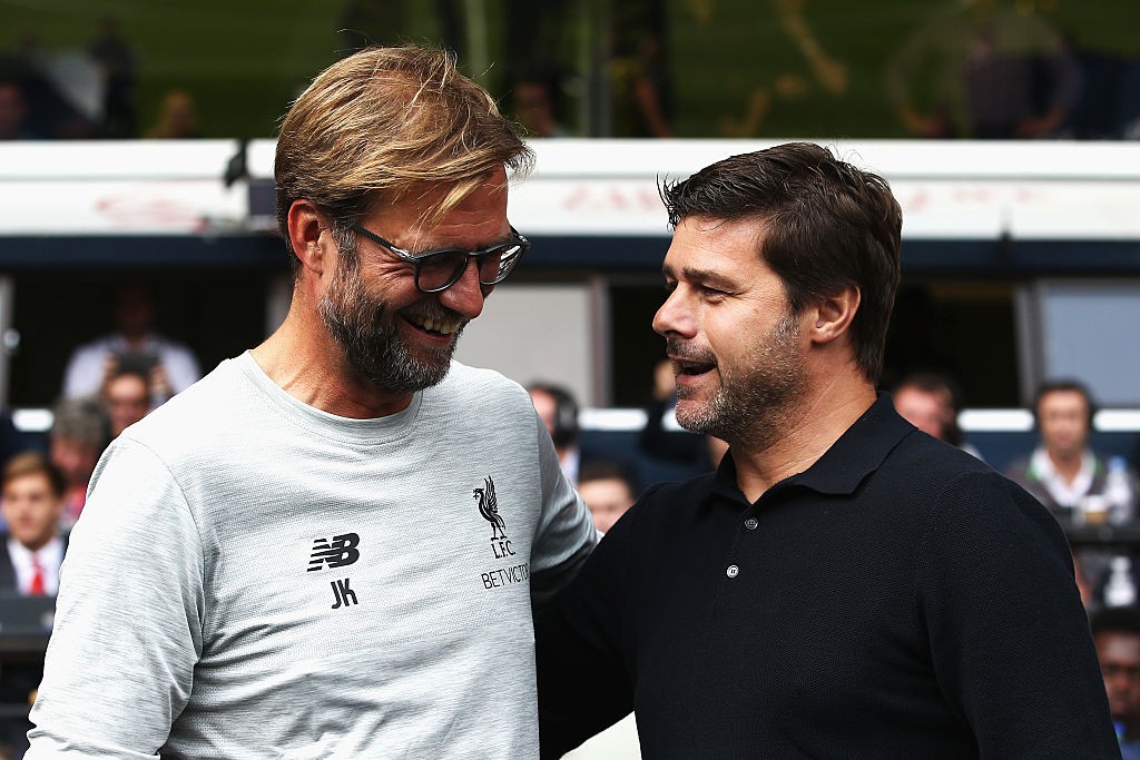 LONDON, ENGLAND - AUGUST 27: Jurgen Klopp, Manager of Liverpool and Mauricio Pochettino, Manager of Tottenham Hotspur exchange words piror to kick off during the Premier League match between Tottenham Hotspur and Liverpool at White Hart Lane on August 27, 2016 in London, England. (Photo by Jan Kruger/Getty Images)