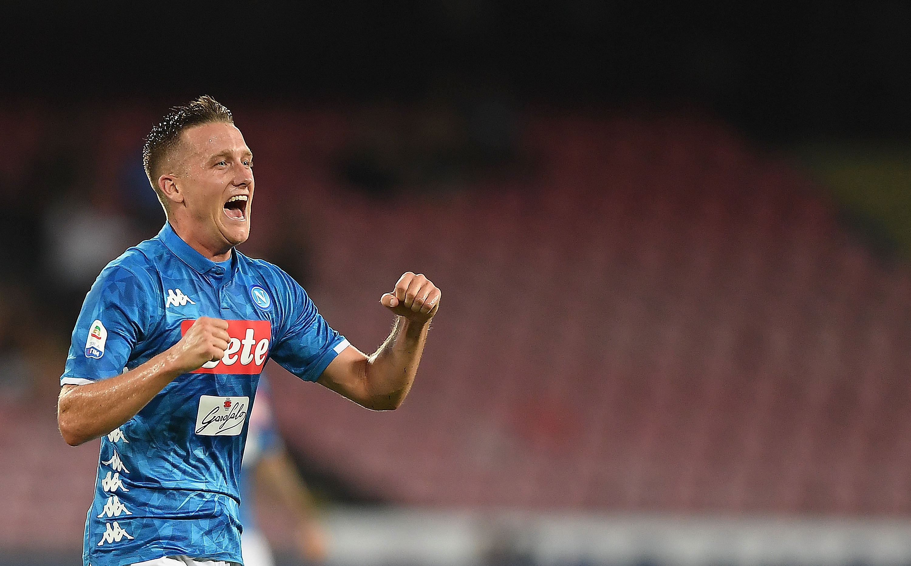 NAPLES, ITALY - AUGUST 25:  Piotr Zielinski of SSC Napoli celebrates after scoring the 2-2 goal during the serie A match between SSC Napoli and AC Milan at Stadio San Paolo on August 25, 2018 in Naples, Italy.  (Photo by Francesco Pecoraro/Getty Images)