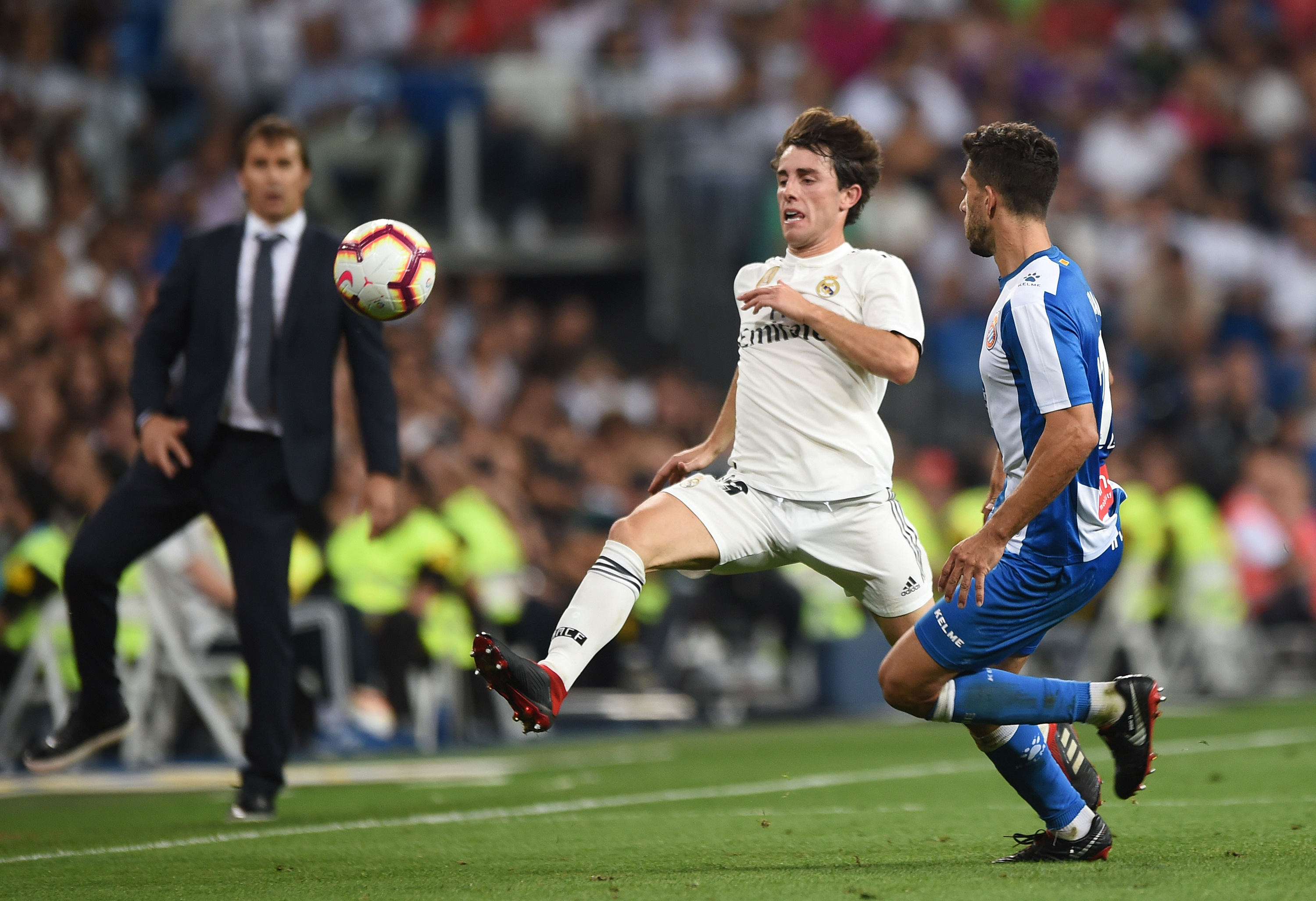 MADRID, SPAIN - SEPTEMBER 22:  Alvaro Odriozola (right) of Real Madrid battles for the ball against Didac Vila of RCD Espanyol during the La Liga match between Real Madrid CF and RCD Espanyol at Estadio Santiago Bernabeu on September 22, 2018 in Madrid, Spain. (Photo by Denis Doyle/Getty Images,)