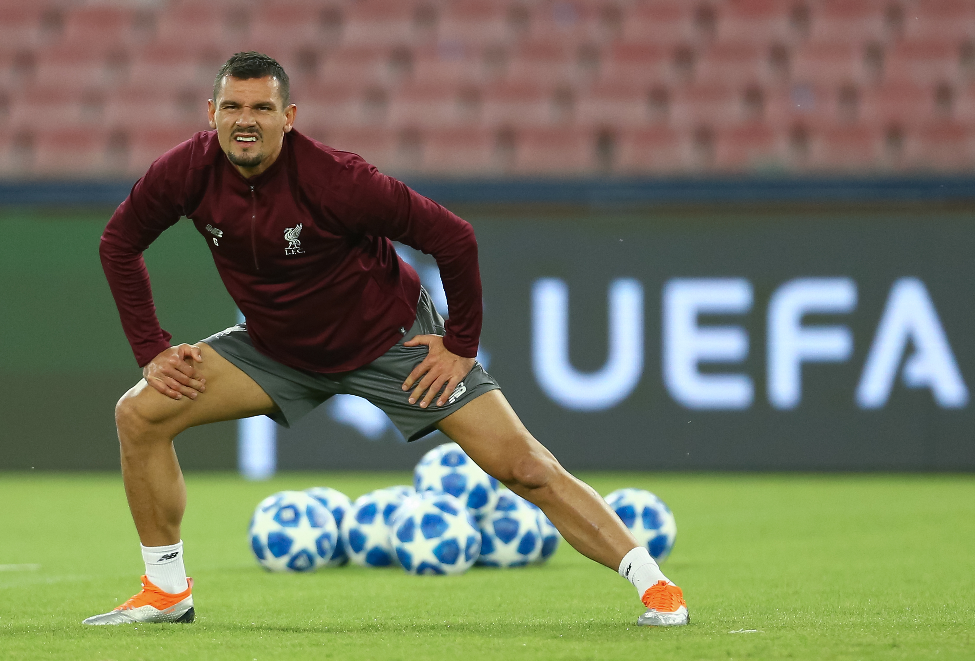 Liverpool's Croatian defender Dejan Lovren stretches during a training session on the eve of the UEFA Champions League Group C football match Napoli vs Liverpool, on October 2, 2018 at the San Paolo stadium in Naples. (Photo by CARLO HERMANN / AFP)        (Photo credit should read CARLO HERMANN/AFP/Getty Images)
