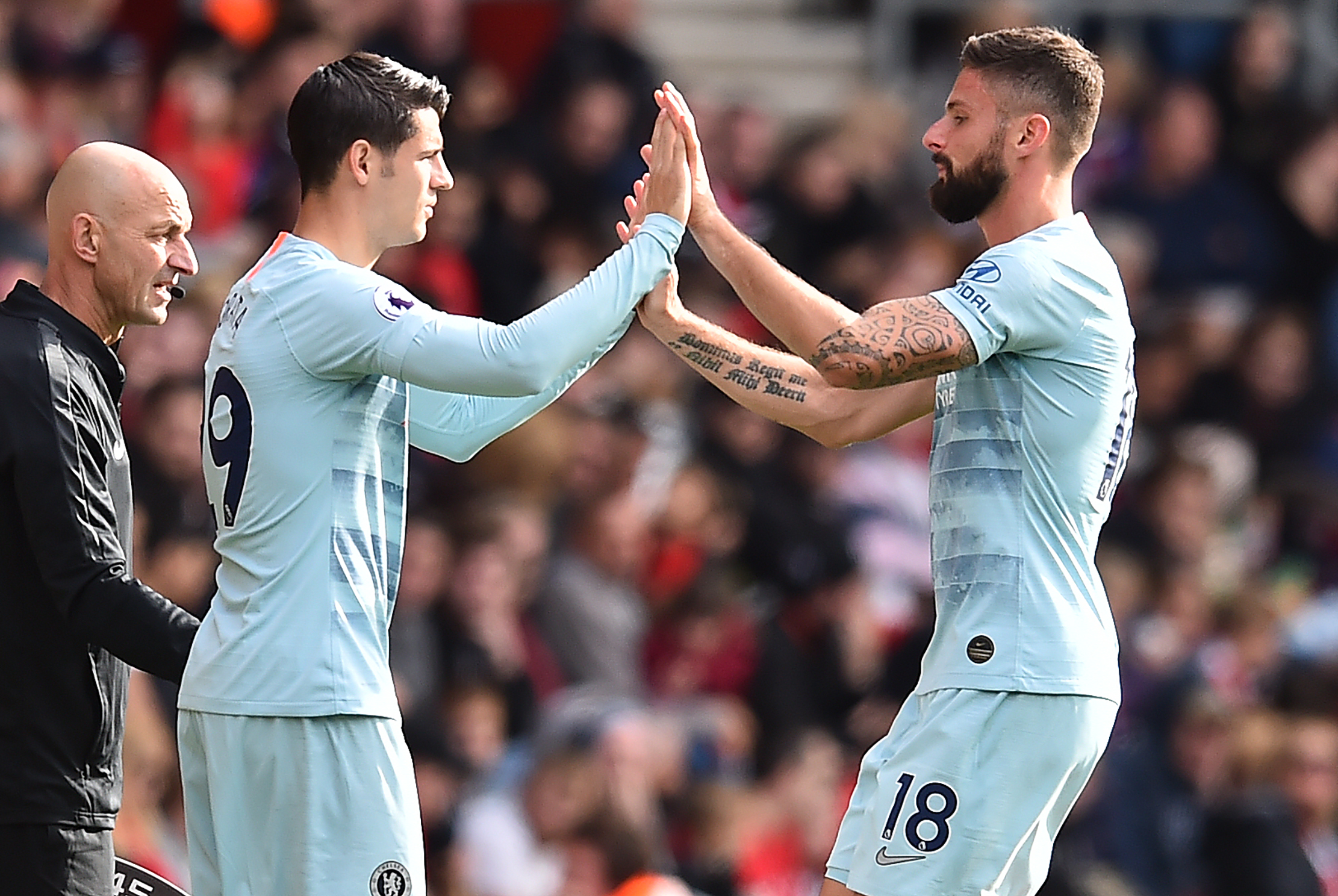 Chelsea's French striker Olivier Giroud (R) leaves the pitch after being substituted off for Chelsea's Spanish striker Alvaro Morata during the English Premier League football match between Southampton and Chelsea at St Mary's Stadium in Southampton, southern England on October 7, 2018. (Photo by Glyn KIRK / AFP) / RESTRICTED TO EDITORIAL USE. No use with unauthorized audio, video, data, fixture lists, club/league logos or 'live' services. Online in-match use limited to 120 images. An additional 40 images may be used in extra time. No video emulation. Social media in-match use limited to 120 images. An additional 40 images may be used in extra time. No use in betting publications, games or single club/league/player publications. /         (Photo credit should read GLYN KIRK/AFP/Getty Images)