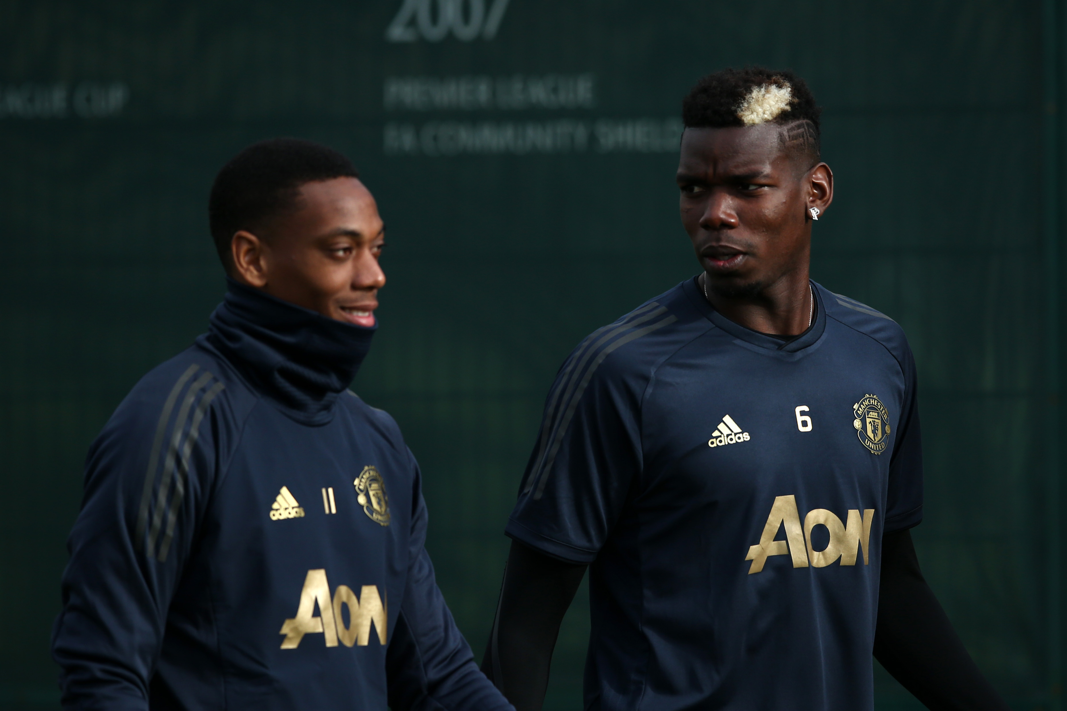 MANCHESTER, ENGLAND - OCTOBER 22:  Anthony Martial of Manchester United and Paul Pogba of Manchester United warm up during a training session ahead of their UEFA Champions League Group H match against Juventus at Aon Training Complex on October 22, 2018 in Manchester, England.  (Photo by Jan Kruger/Getty Images)