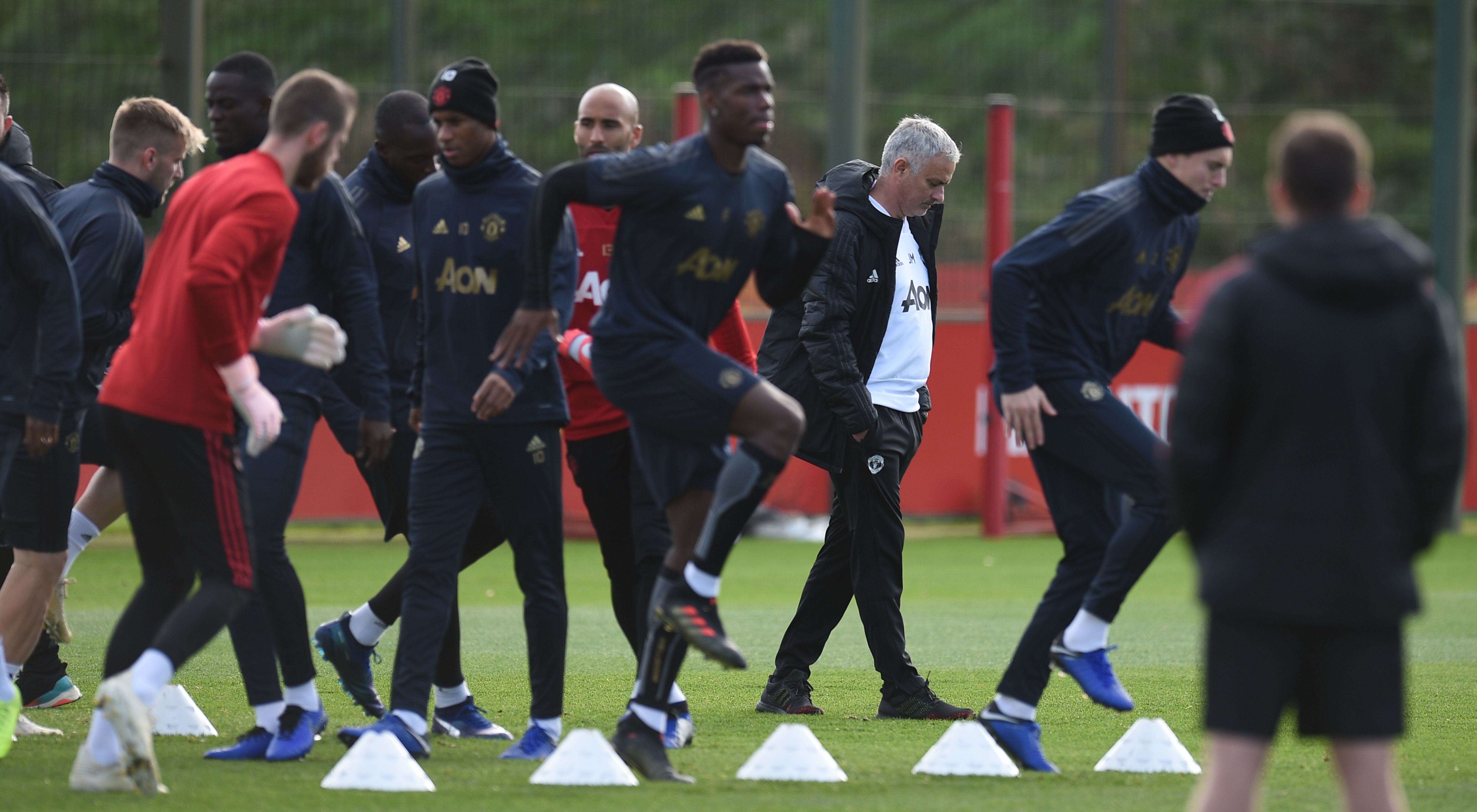 Manchester United's Portuguese manager Jose Mourinho (C) attends a training session at the Carrington Training complex in Manchester, north west England on October 22, 2018, ahead of their UEFA Champions League group H football match against Juventus on October 23. (Photo by Oli SCARFF / AFP)        (Photo credit should read OLI SCARFF/AFP/Getty Images)