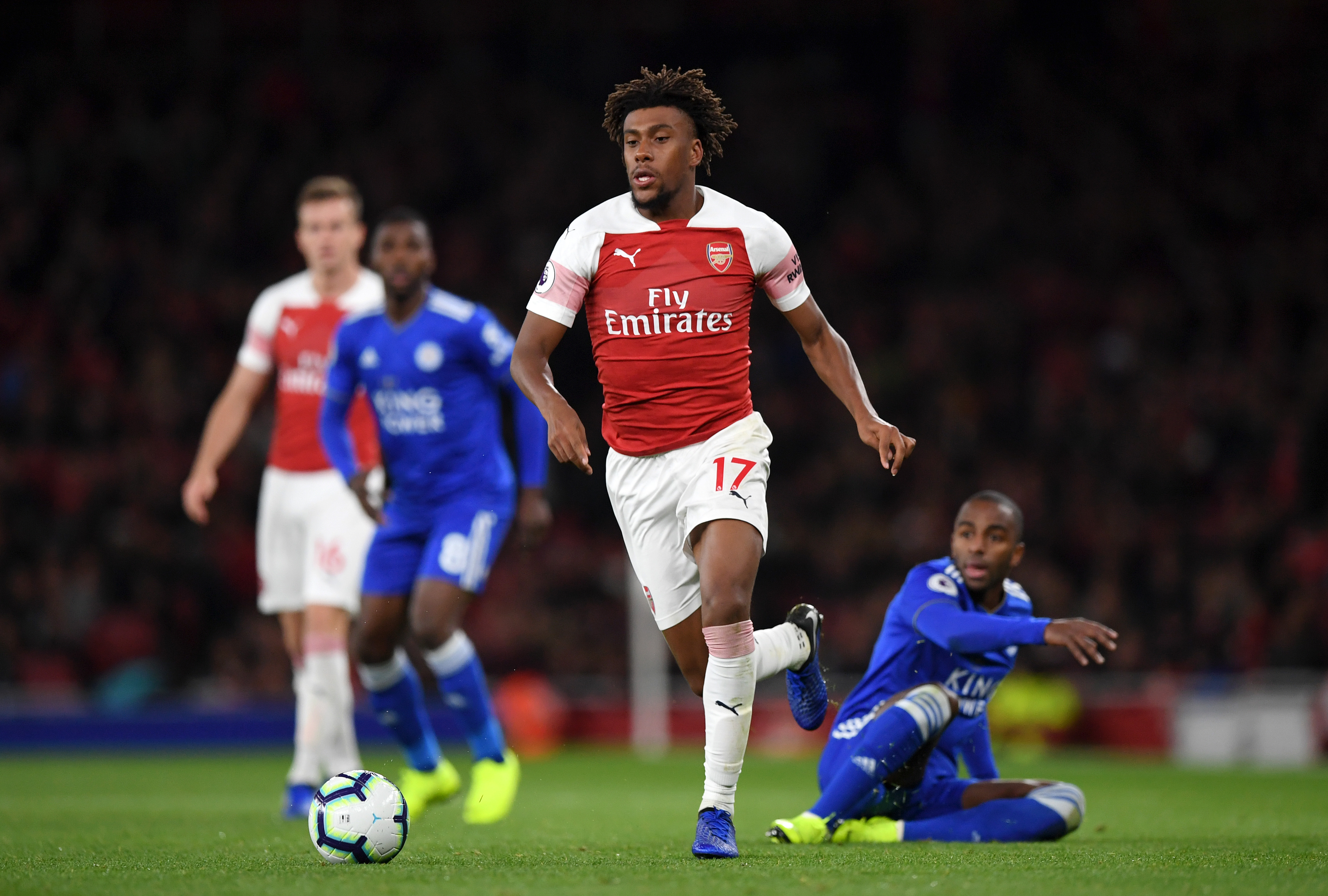 LONDON, ENGLAND - OCTOBER 22:  Alex Iwobi of Arsenal is tackled by Ricardo Pereira of Leicester City during the Premier League match between Arsenal FC and Leicester City at Emirates Stadium on October 22, 2018 in London, United Kingdom.  (Photo by Shaun Botterill/Getty Images)