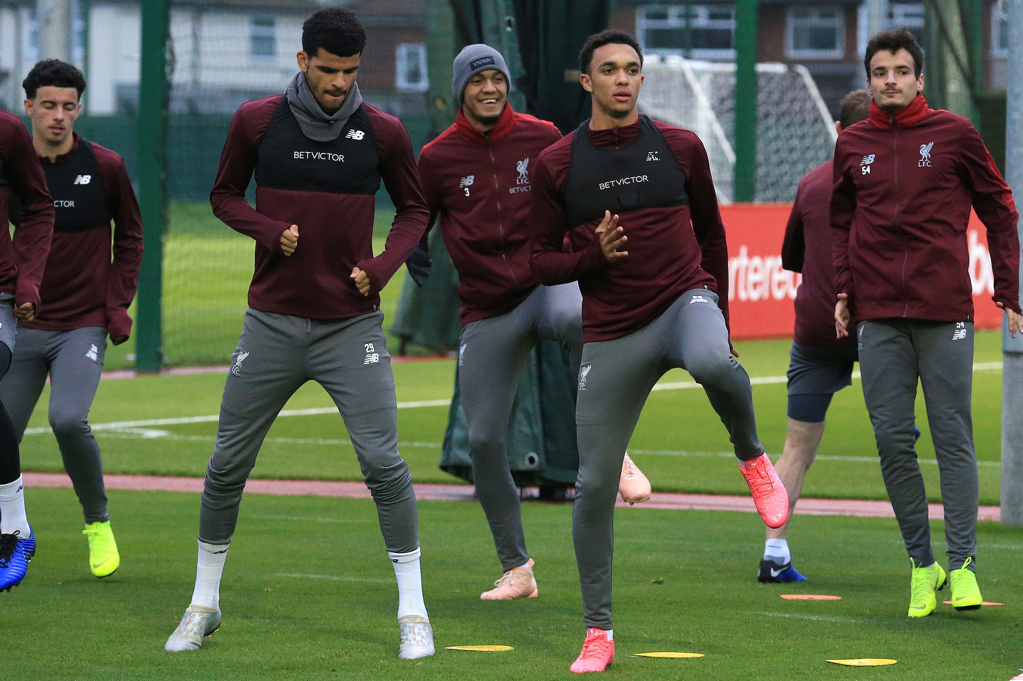 Liverpool's English striker Dominic Solanke (centre left) and Liverpool's English defender Trent Alexander-Arnold (centre right) take part in a Liverpool team training session at Melwood in Liverpool, north west England on October 23, 2018, on the eve of their UEFA Champions League group C football match against Red Star Belgrade. (Photo by Lindsey PARNABY / AFP)        (Photo credit should read LINDSEY PARNABY/AFP/Getty Images)