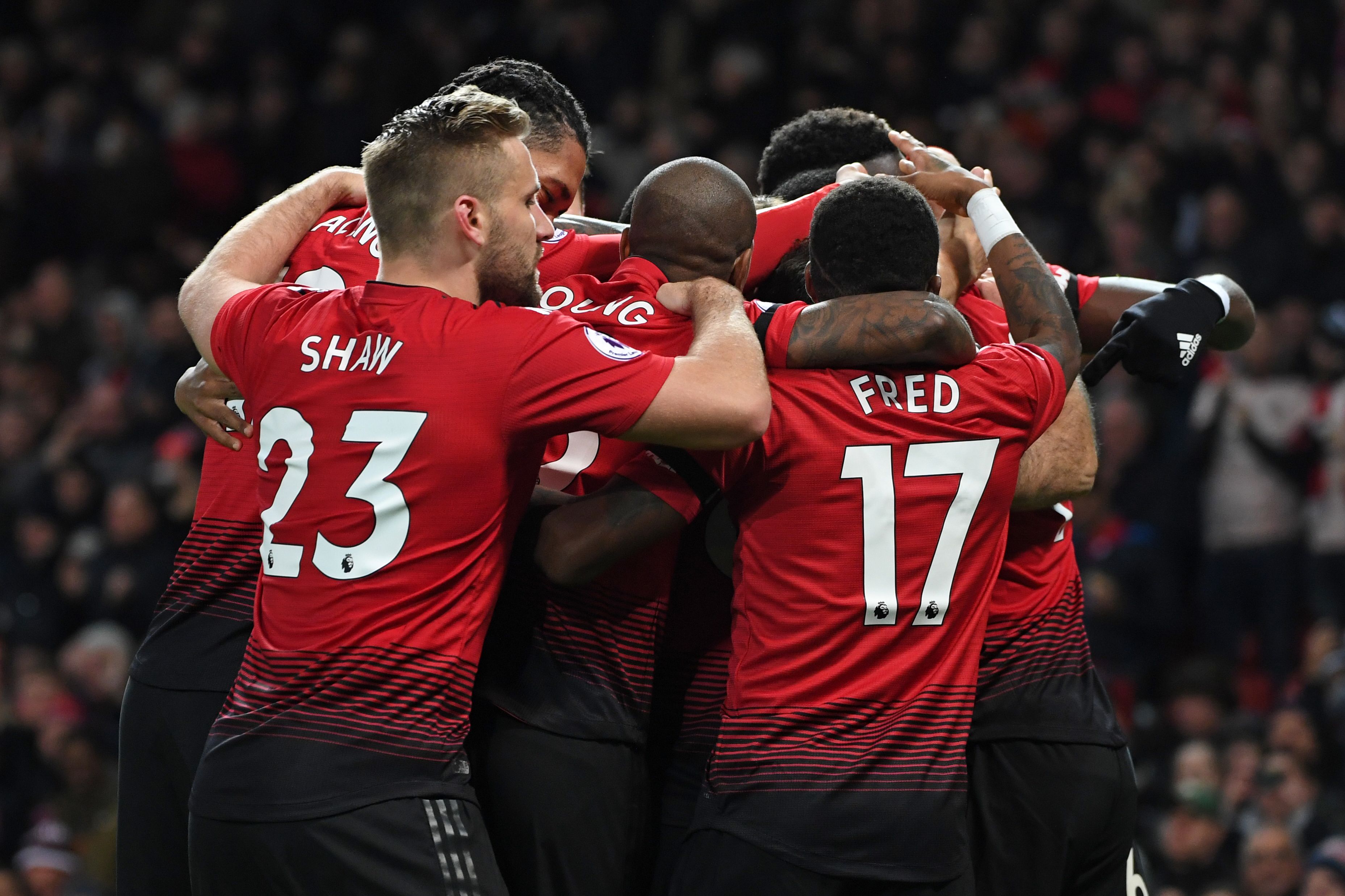 Manchester United's French striker Anthony Martial celebrates with teammates after scoring their second goal during the English Premier League football match between Manchester United and Everton at Old Trafford in Manchester, north west England, on October 28, 2018. (Photo by Paul ELLIS / AFP) / RESTRICTED TO EDITORIAL USE. No use with unauthorized audio, video, data, fixture lists, club/league logos or 'live' services. Online in-match use limited to 120 images. An additional 40 images may be used in extra time. No video emulation. Social media in-match use limited to 120 images. An additional 40 images may be used in extra time. No use in betting publications, games or single club/league/player publications. /         (Photo credit should read PAUL ELLIS/AFP/Getty Images)