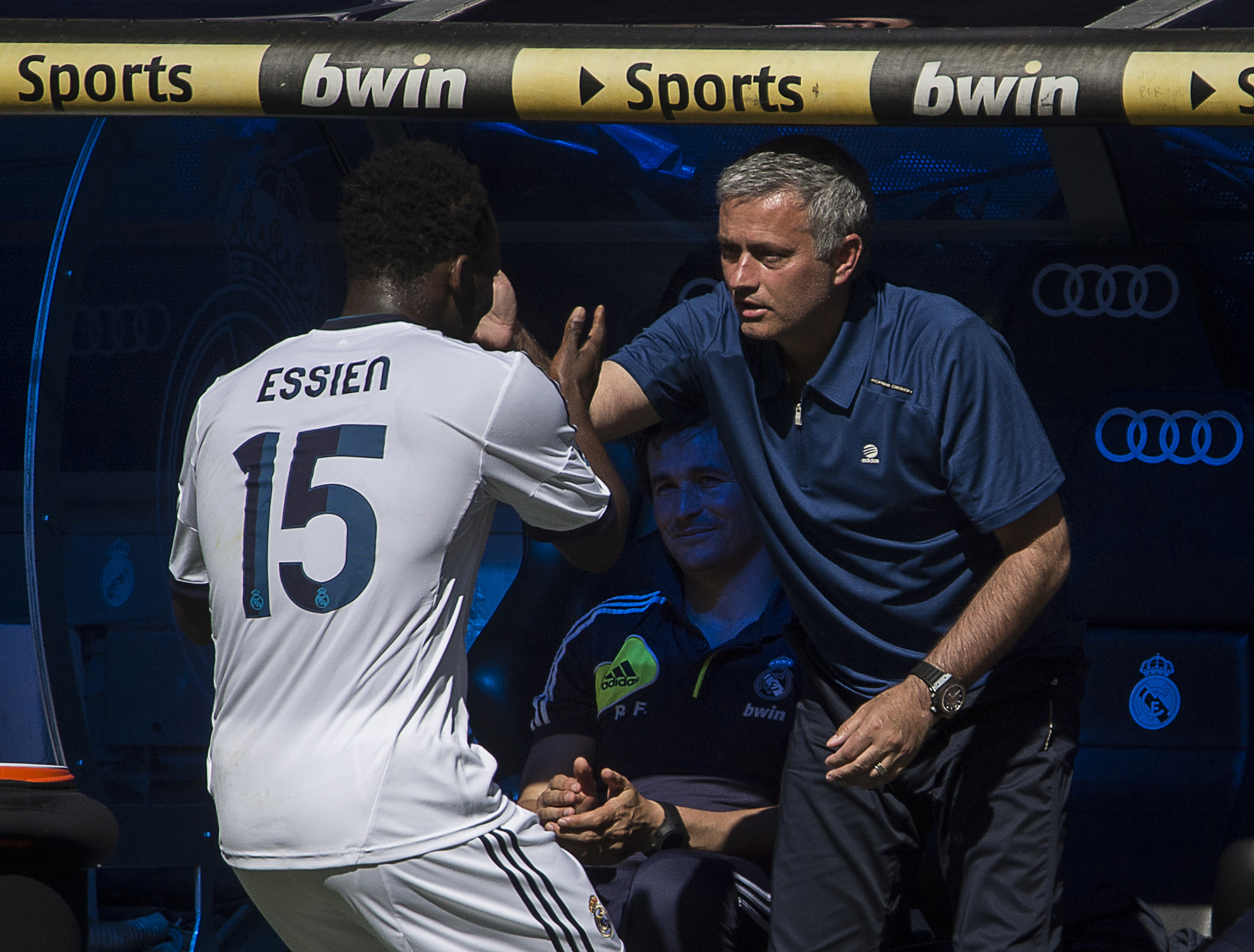Real Madrid's Ghanaian midfielder Michael Essien (L) celebrates with Real Madrid's Portuguese coach Jose Mourinho after scoring during the Spanish League football match Real Madrid CF vs Osasuna at the Santiago Bernabeu stadium in Madrid on June 1,  2013.  AFP PHOTO/ DANI POZO        (Photo credit should read DANI POZO/AFP/Getty Images)