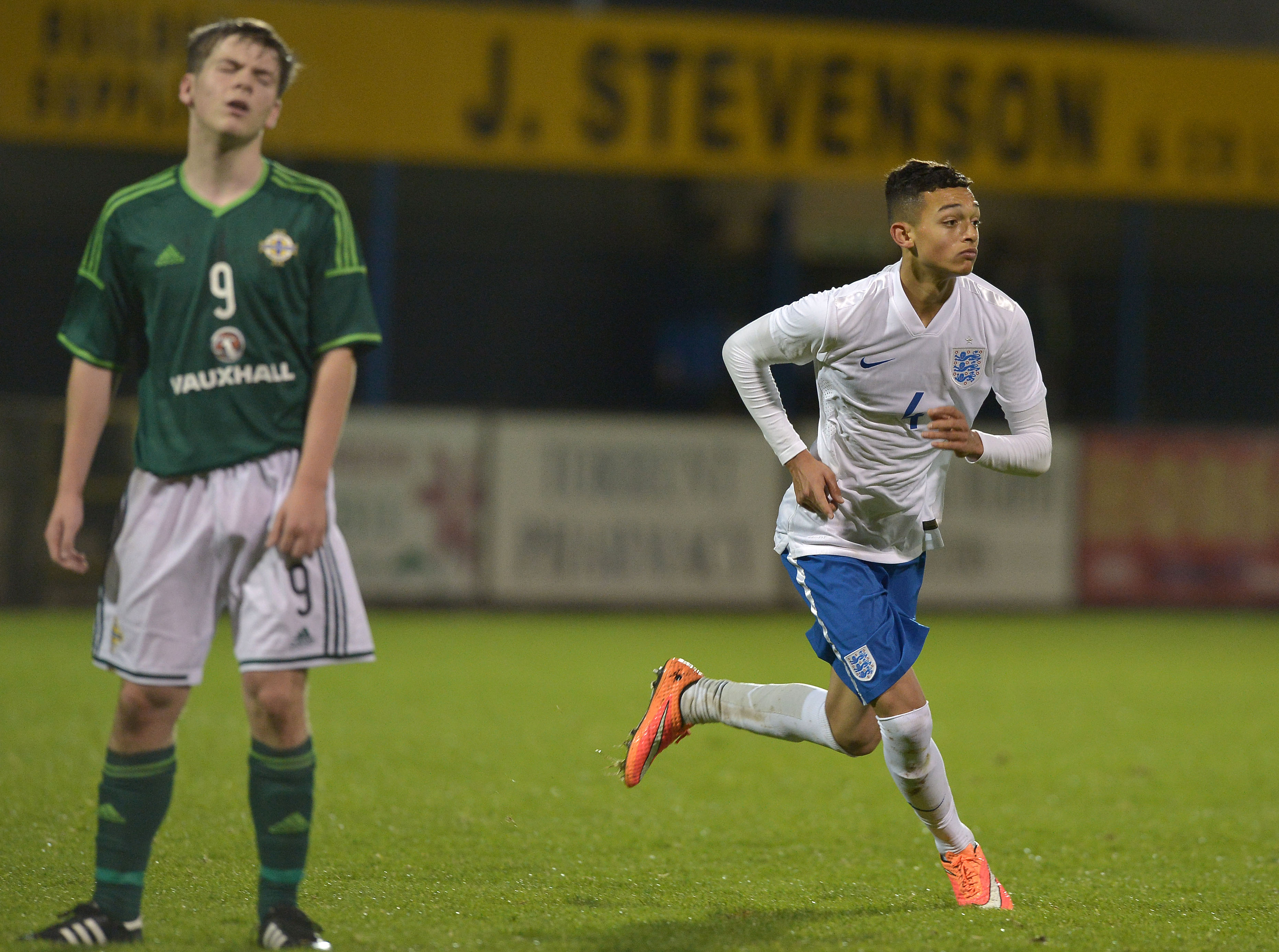 DUNGANNON, NORTHERN IRELAND - NOVEMBER 07:  Andre Dozzell of England (R) celebrates scoring the opening goal during this evenings Sky Sports Victory Shield U16 international game between Northern Ireland and England at Stangmore Park on November 7, 2014 in Dungannon, Northern Ireland.  (Photo by Charles McQuillan/Getty Images)