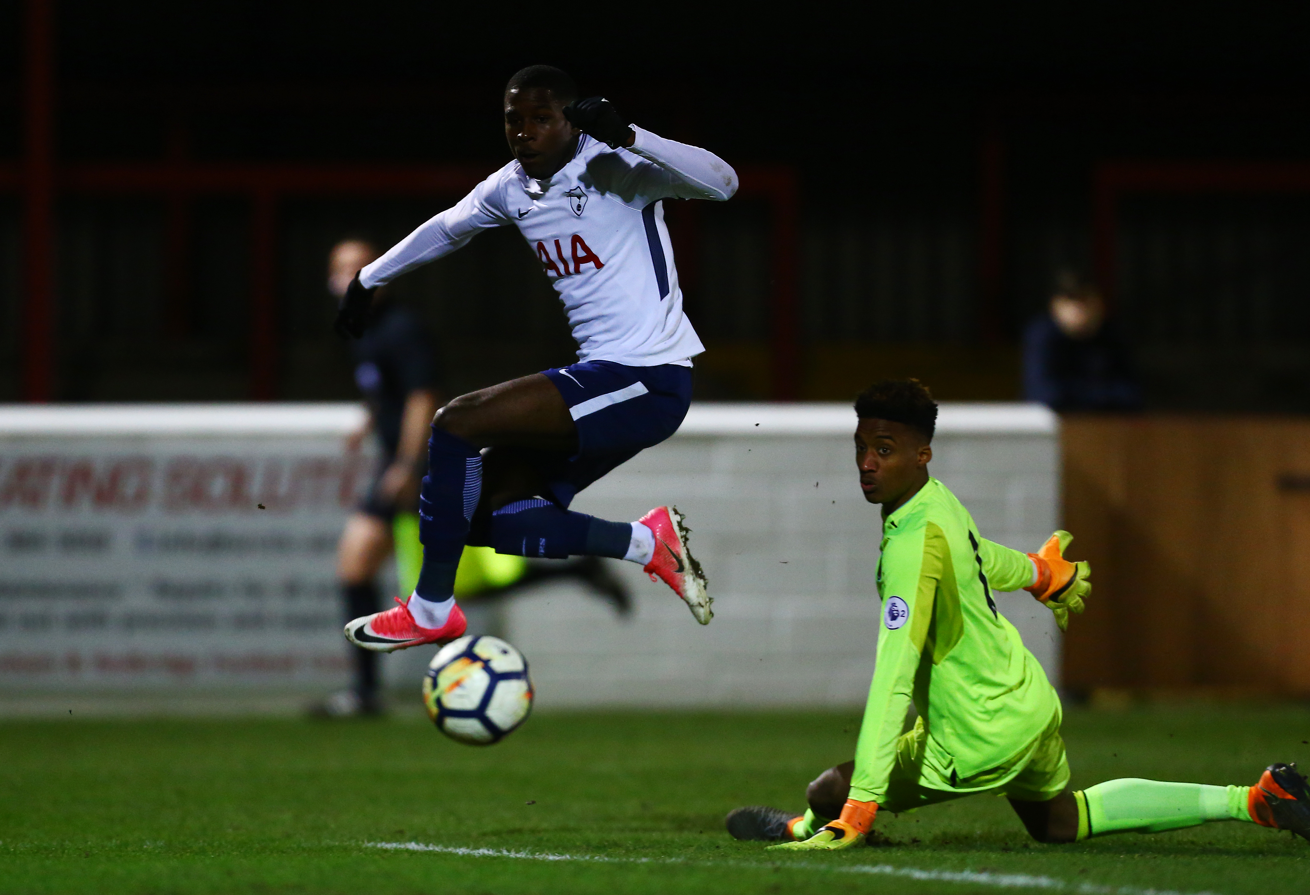 DAGENHAM, ENGLAND - FEBRUARY 12:  Shilow Tracey of Tottenham scores his sides second goal past Nathan Trott of West Ham during the Premier League 2 match between West Ham United and Tottenham Hotspur at Chigwell Construction Stadium on February 12, 2018 in Dagenham, England.  (Photo by Jordan Mansfield/Getty Images)