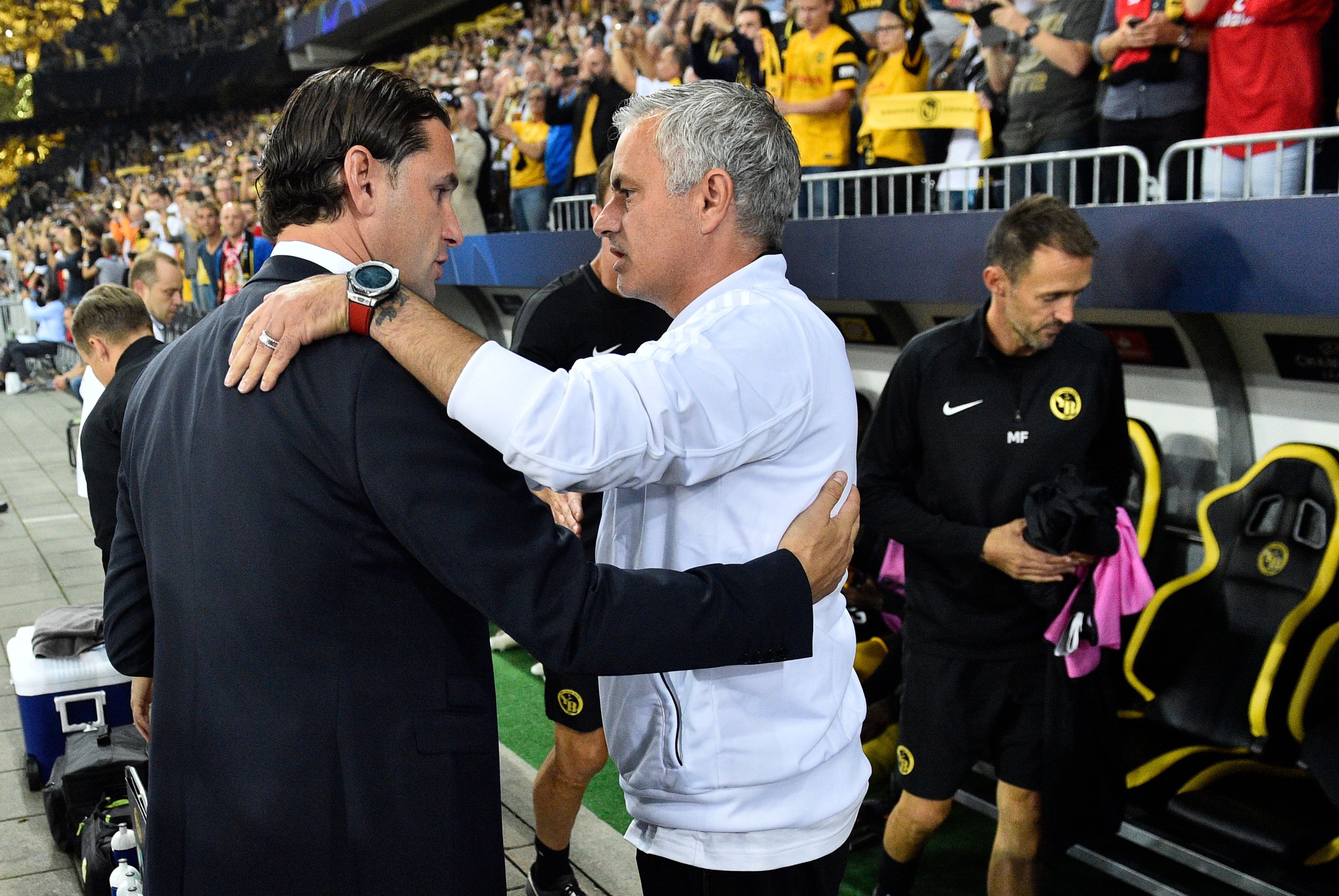 Manchester United's Portuguese manager Jose Mourinho (C) embraces Young Boys Swiss head coach Gerardo Seoane ahead of the UEFA Champions League group H football match between Young Boys and Manchester United at The Stade de Suisse in Bern on September 19, 2018. (Photo by Alain GROSCLAUDE / AFP)        (Photo credit should read ALAIN GROSCLAUDE/AFP/Getty Images)