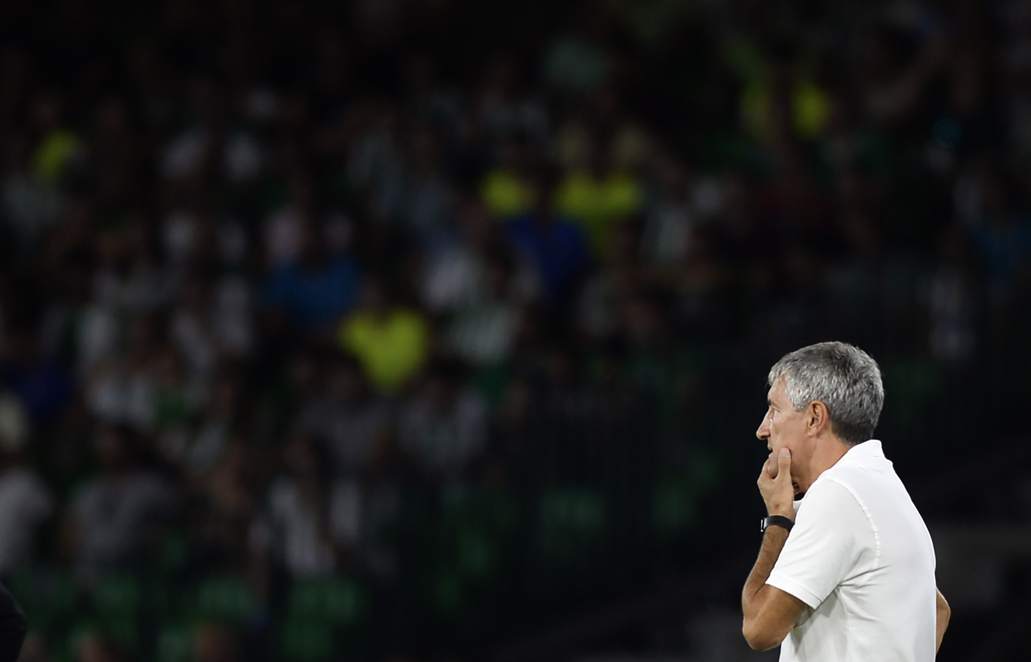 Real Betis' Spanish coach Quique Setien looks at the game from the sideline during the Spanish league football match between Real Betis and Athletic Club Bilbao at the Benito Villamarin stadium in Seville on September 23, 2018. (Photo by CRISTINA QUICLER / AFP)        (Photo credit should read CRISTINA QUICLER/AFP/Getty Images)